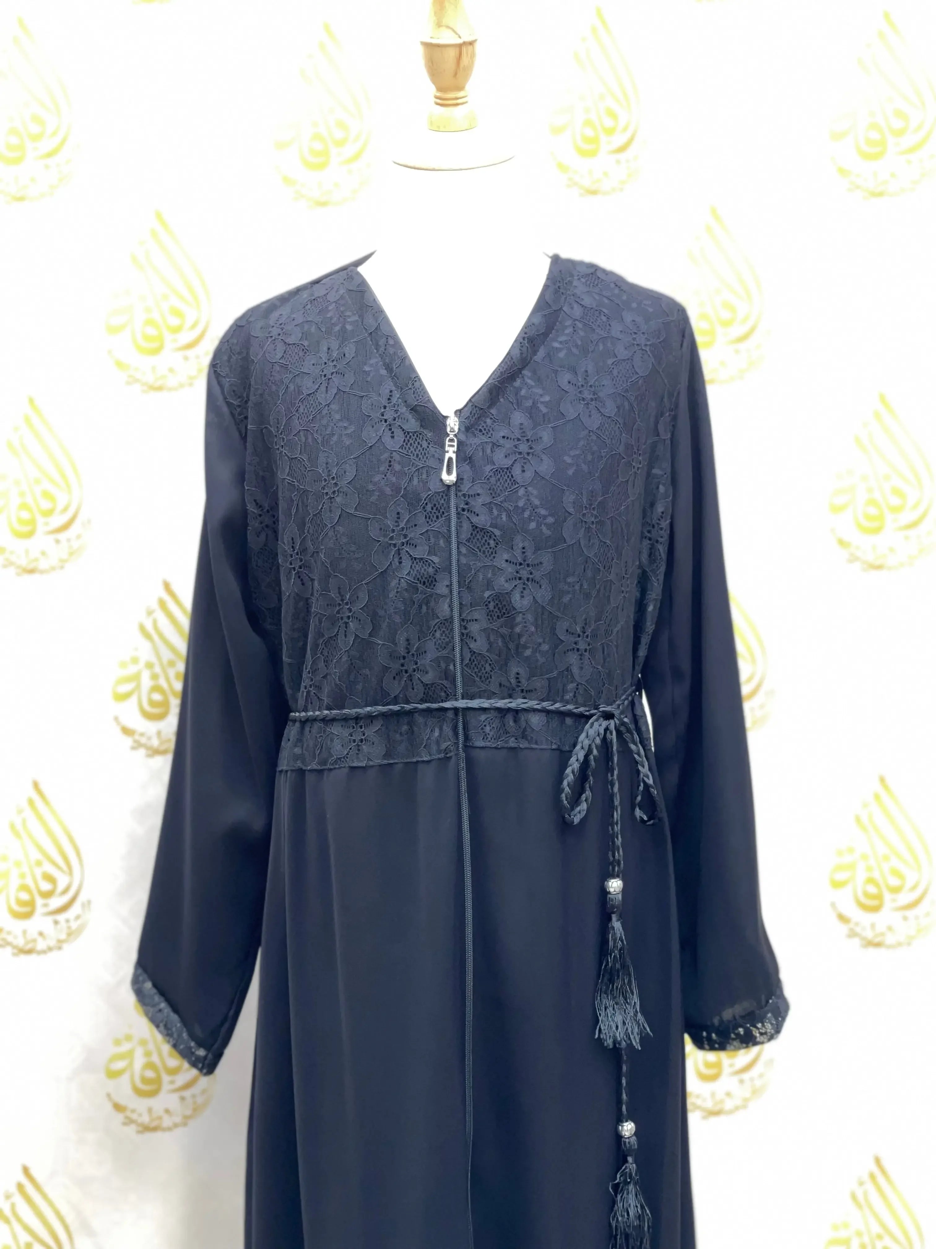 Palestinian Elegance kids zippered abaya in black with floral lace details and waist tie tassels