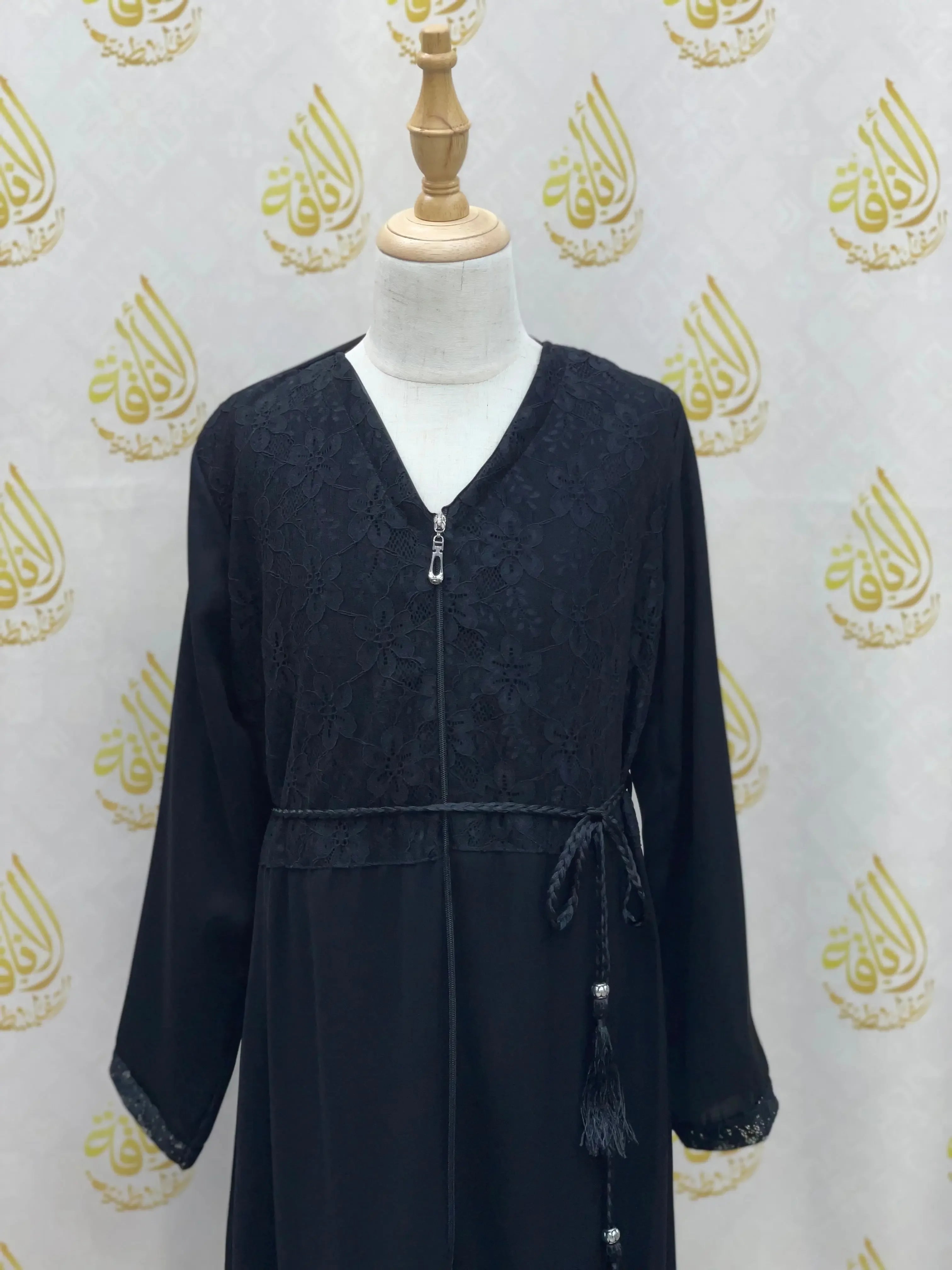 Palestinian Elegance black kids zippered abaya with floral embroidery and waist tassel detail