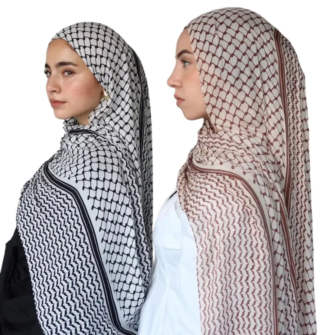 Two women wearing kuffiyeh print cotton hijab by Palestinian Elegance in black and maroon patterns