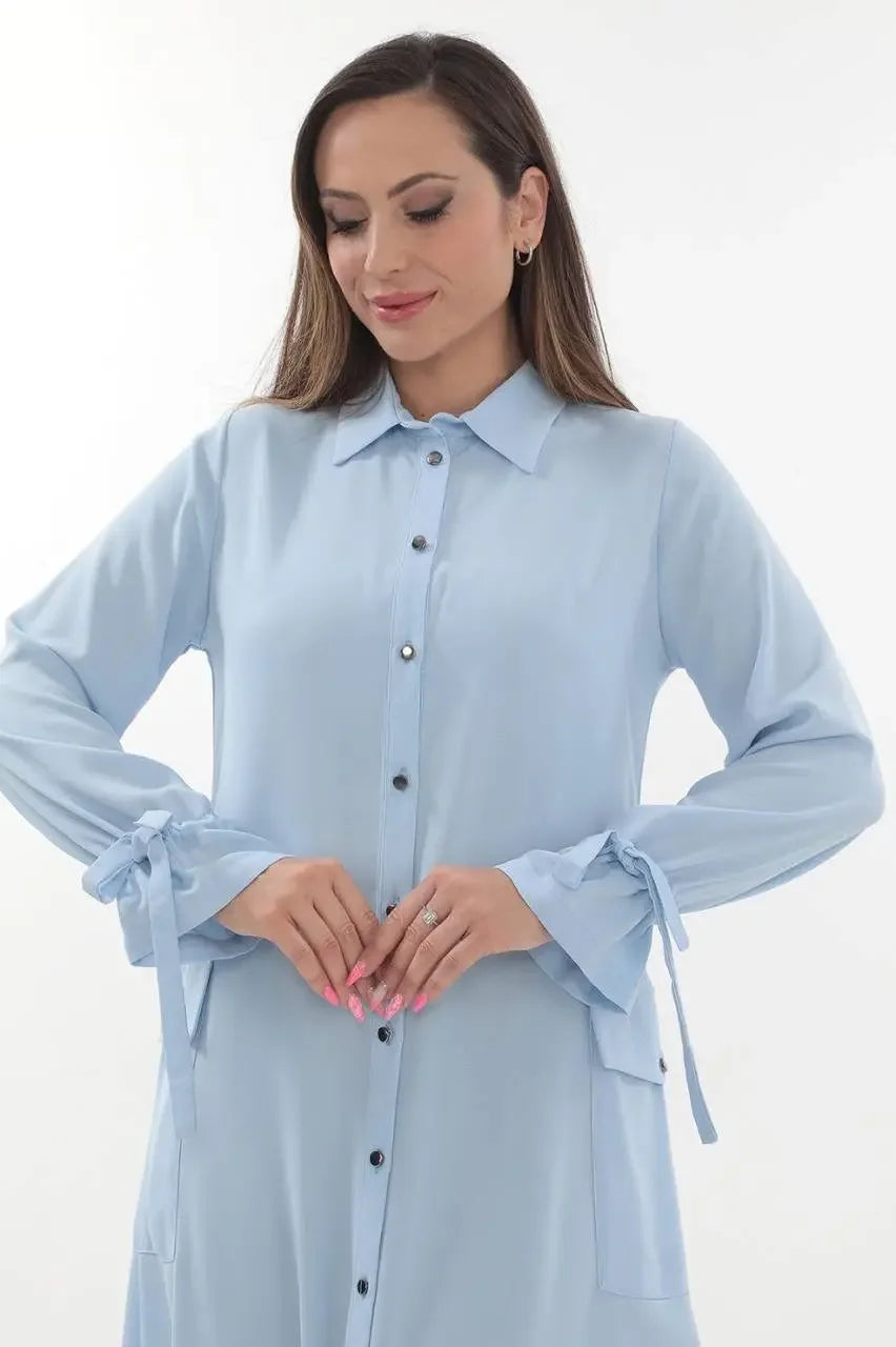 Palestinian Elegance long relaxed tunic for women in light blue with button front and tied sleeve cuffs