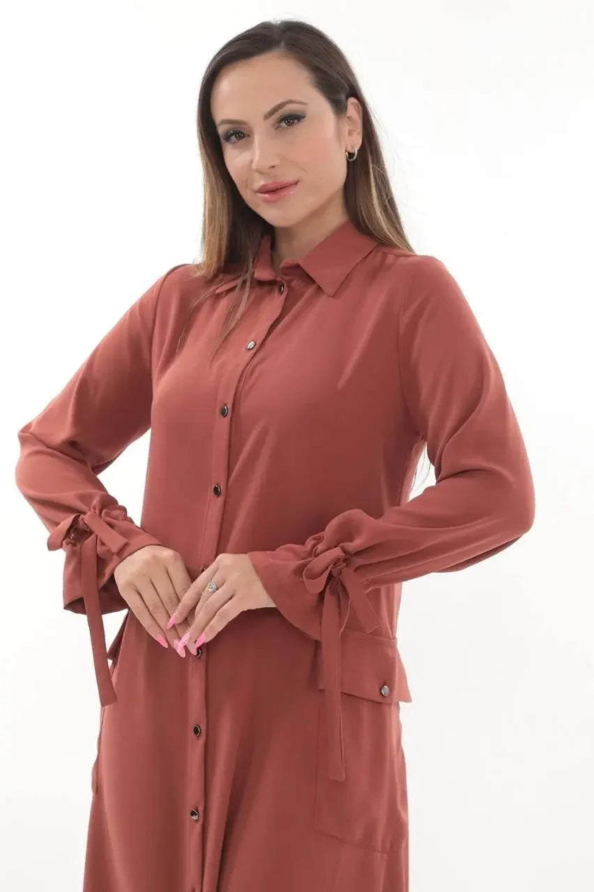 Palestinian Elegance long relaxed tunic for women in rust color with button front and tied cuffs