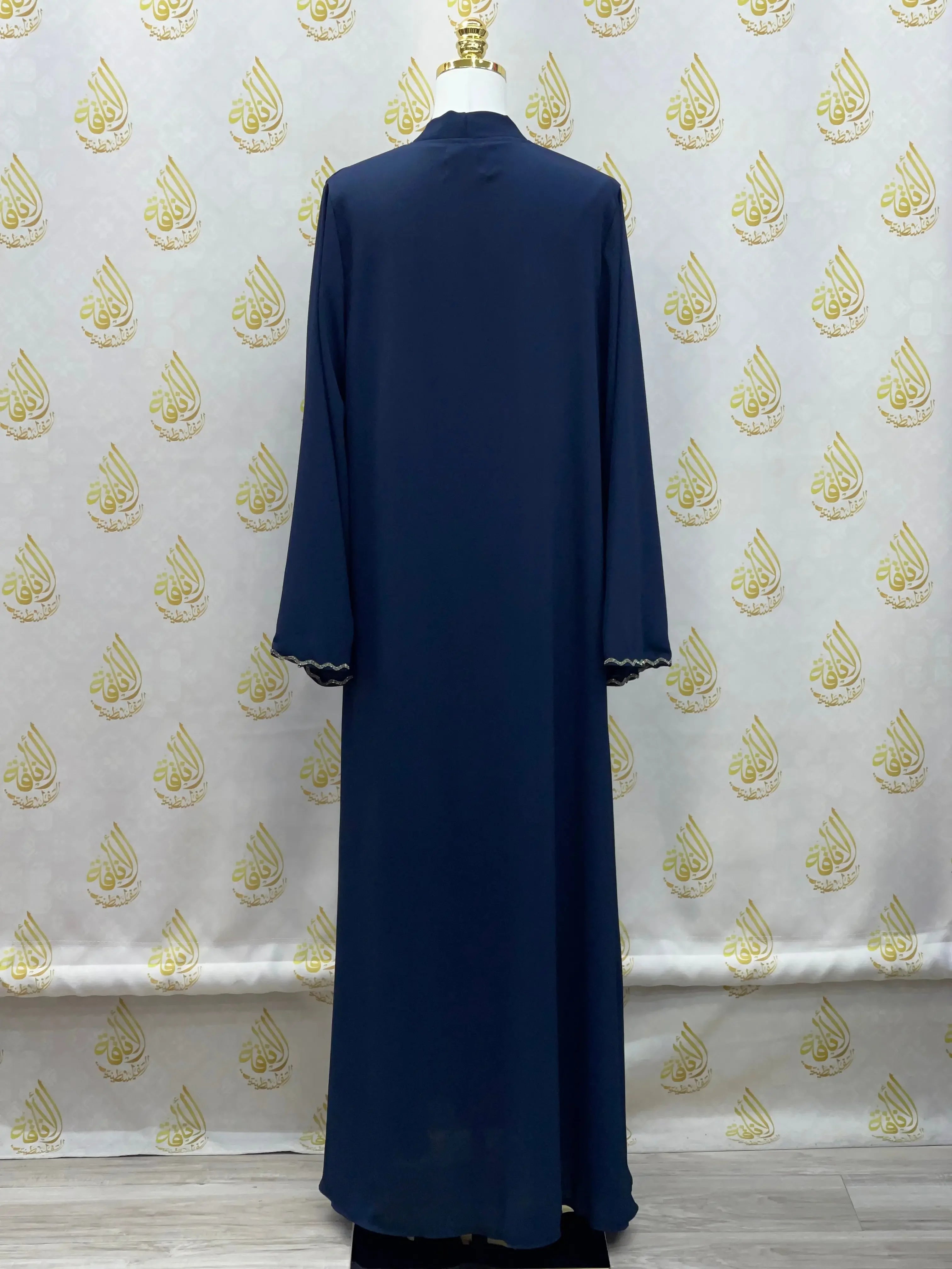Back view of luxurious cloche cut abaya in navy blue by Palestinian Elegance with long sleeves