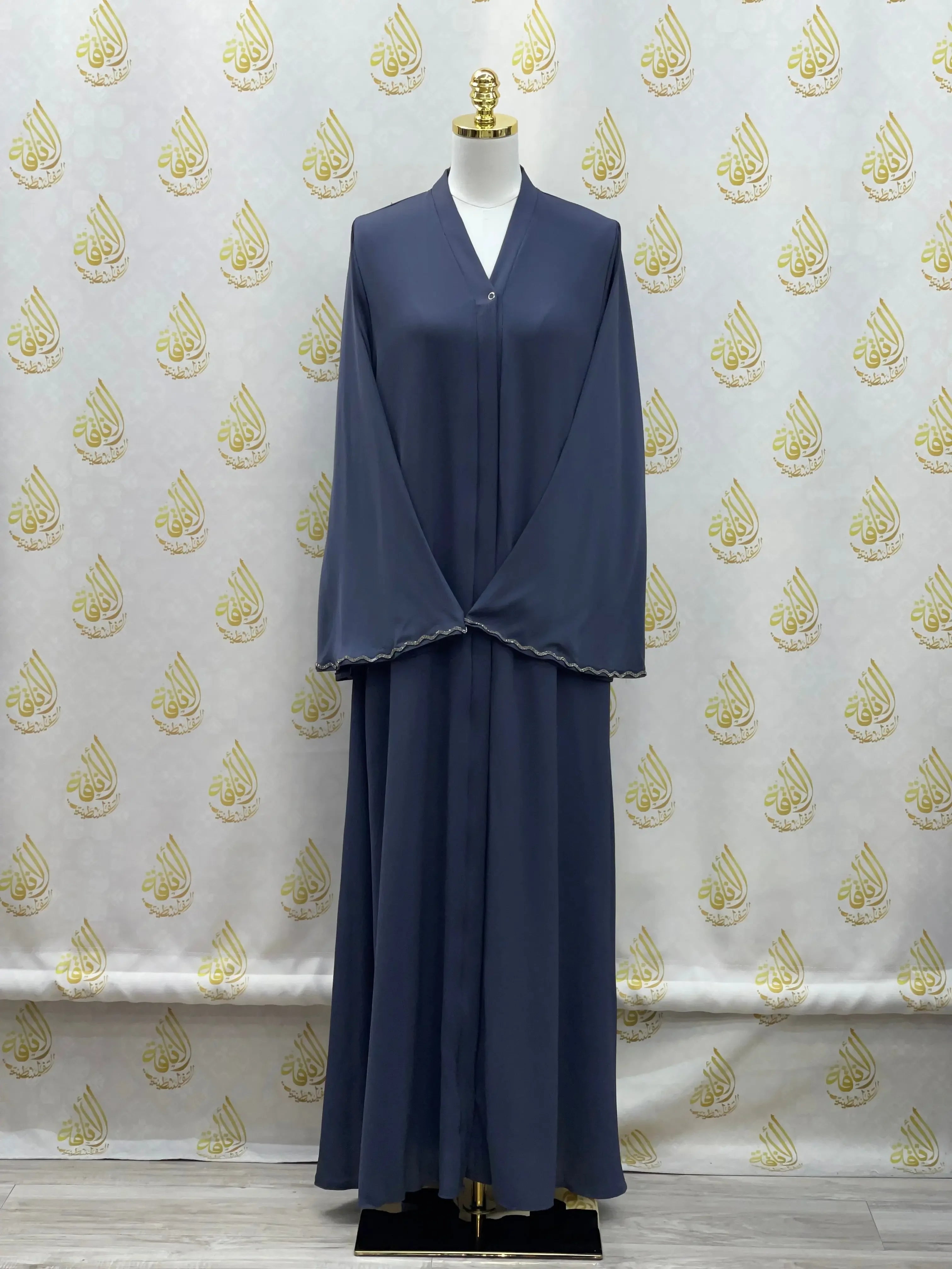 Palestinian Elegance luxurious cloche cut abaya in navy blue displayed on mannequin