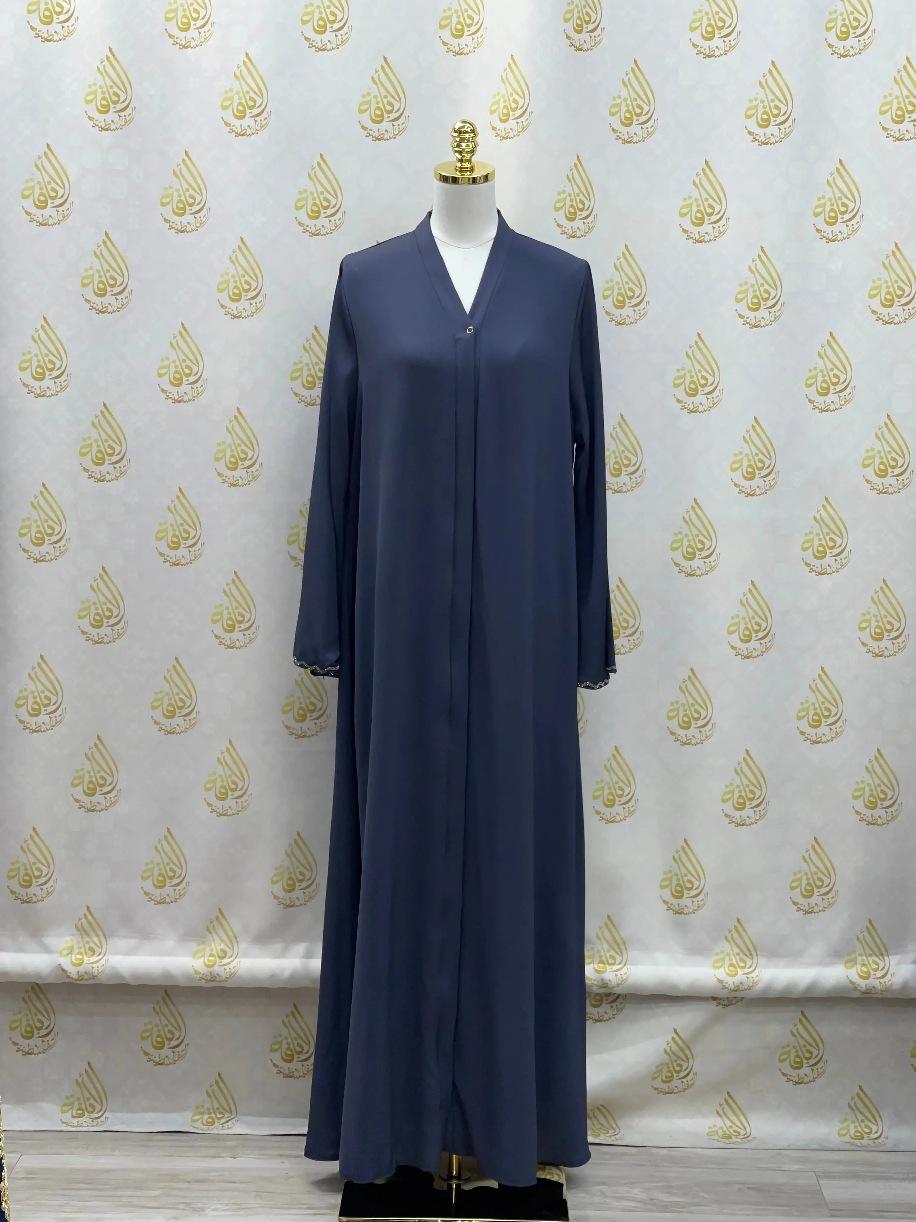 Palestinian Elegance luxurious cloche cut abaya in dark blue displayed on mannequin