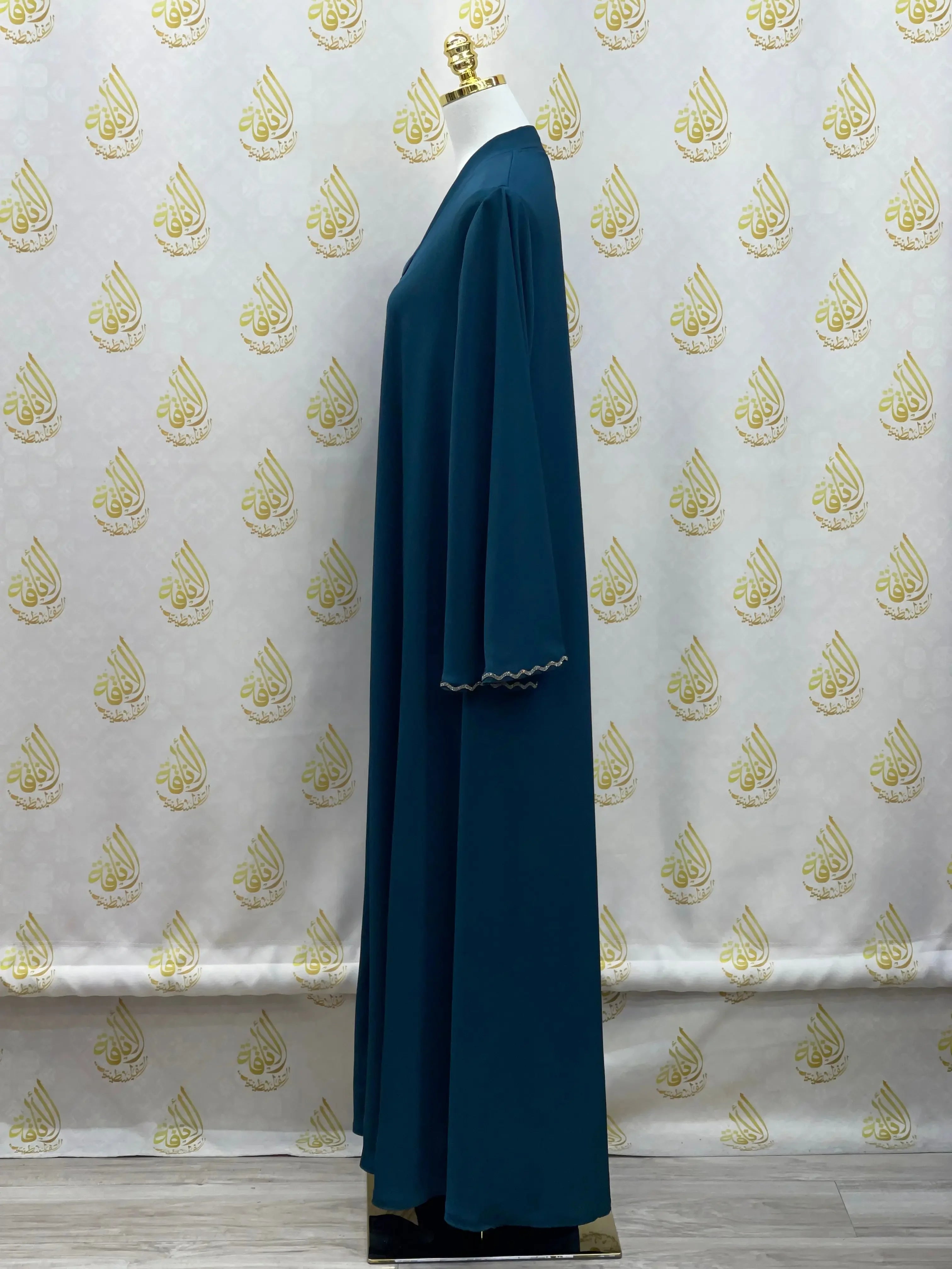 Palestinian Elegance luxurious cloche cut abaya in dark teal with scalloped sleeve edges