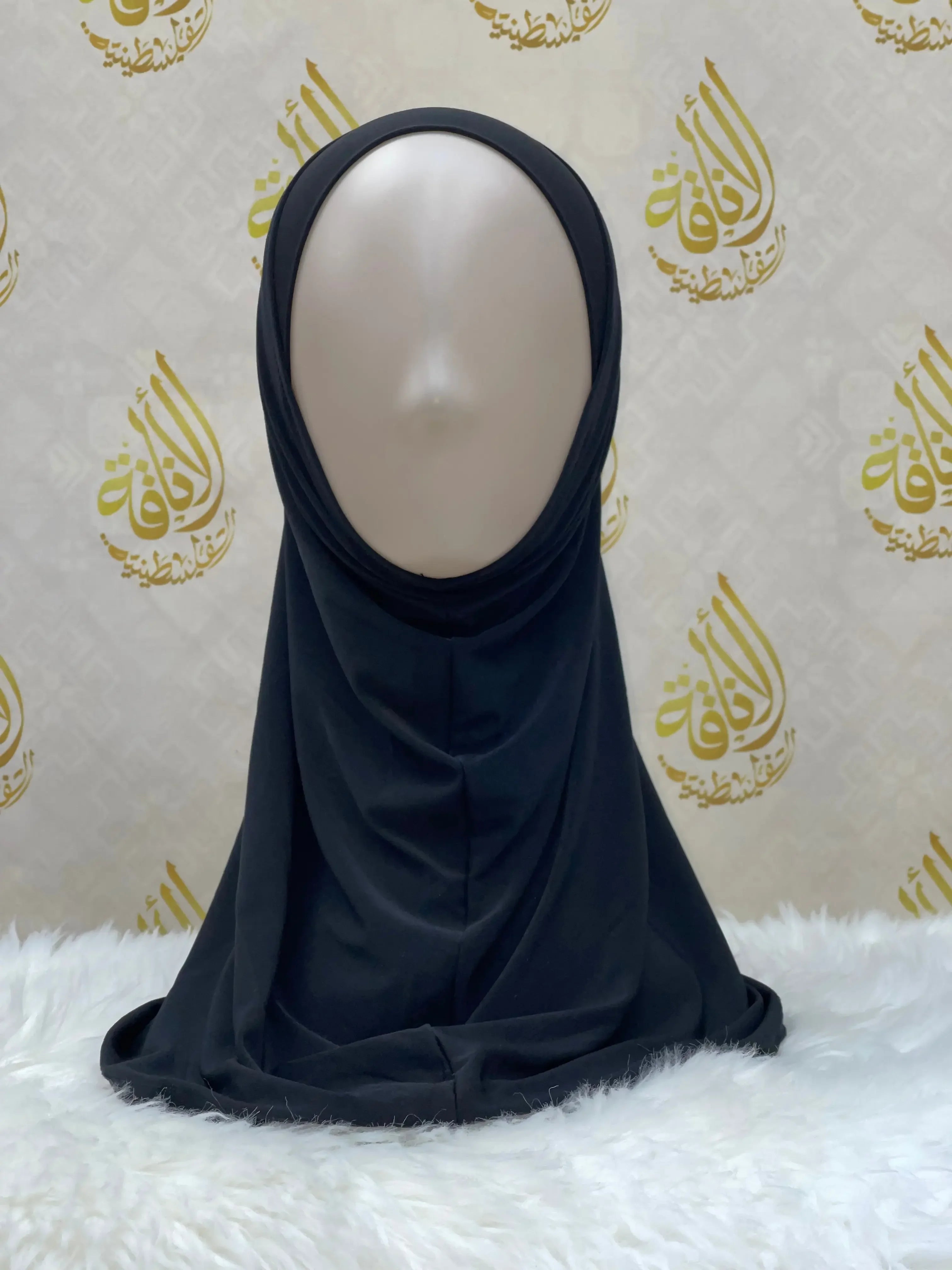 Palestinian Elegance black lycra hijab for women displayed on mannequin with elegant drape