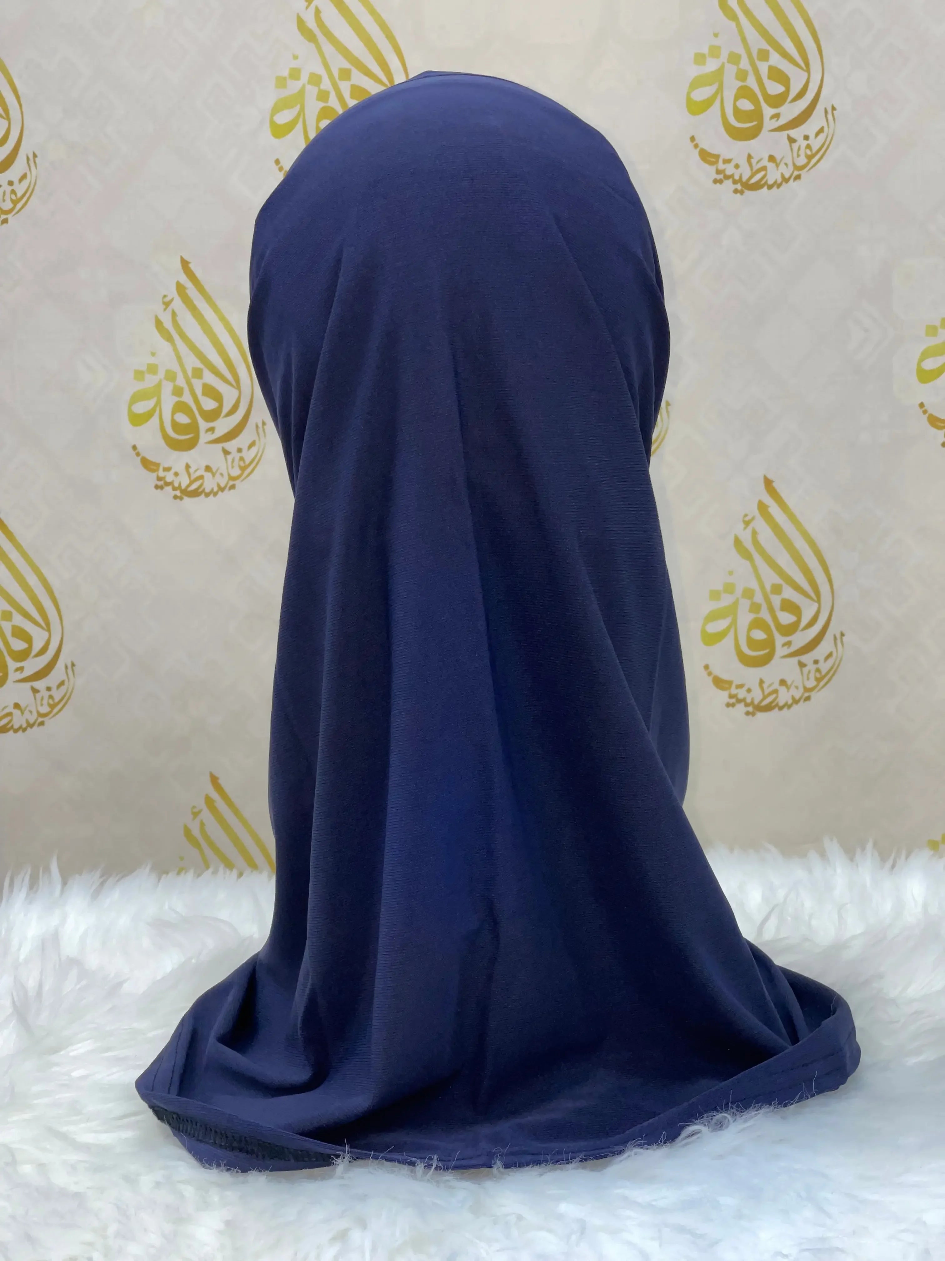 Navy blue lycra hijab for women displayed on mannequin with Palestinian Elegance branding background