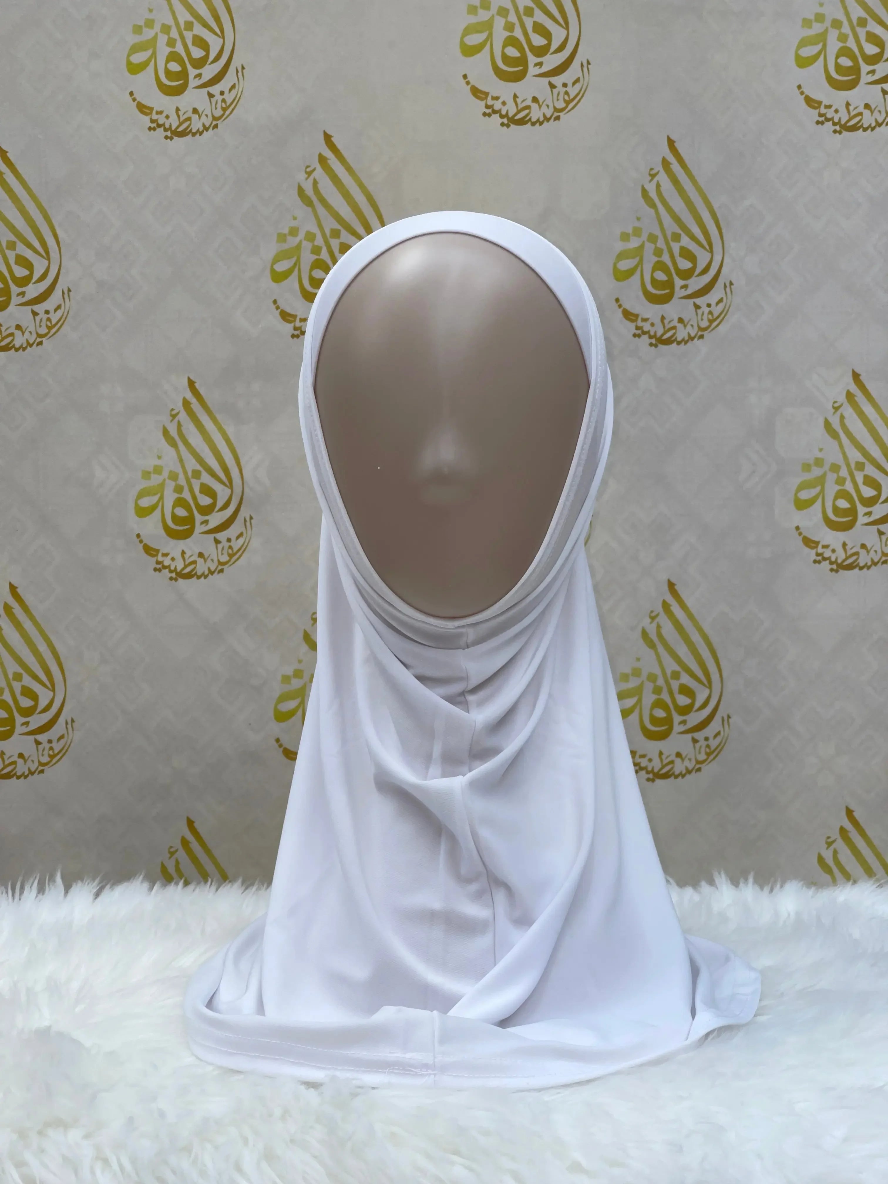 White lycra hijab for women displayed on a mannequin by Palestinian Elegance