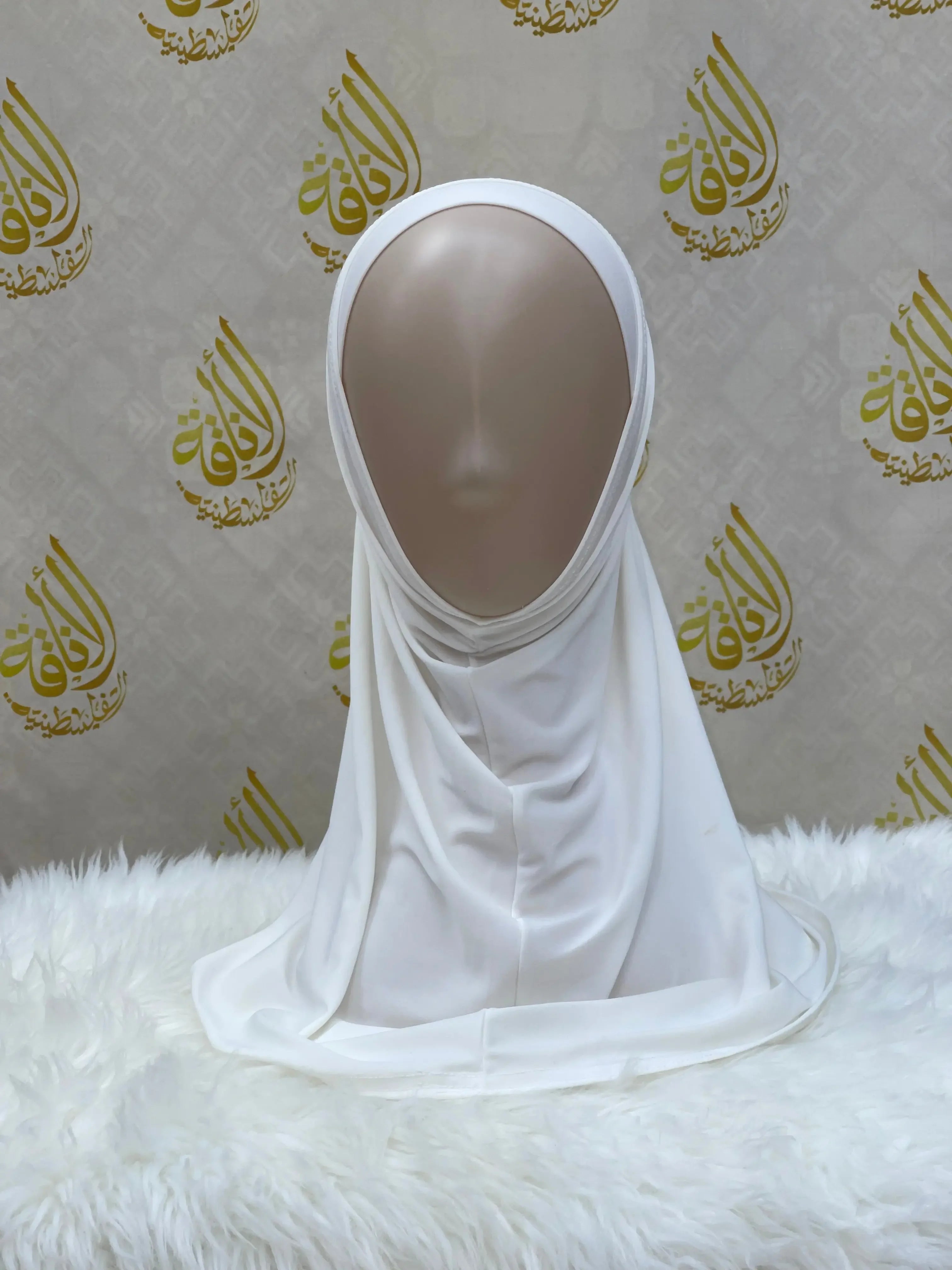 White lycra hijab for women displayed on mannequin by Palestinian Elegance