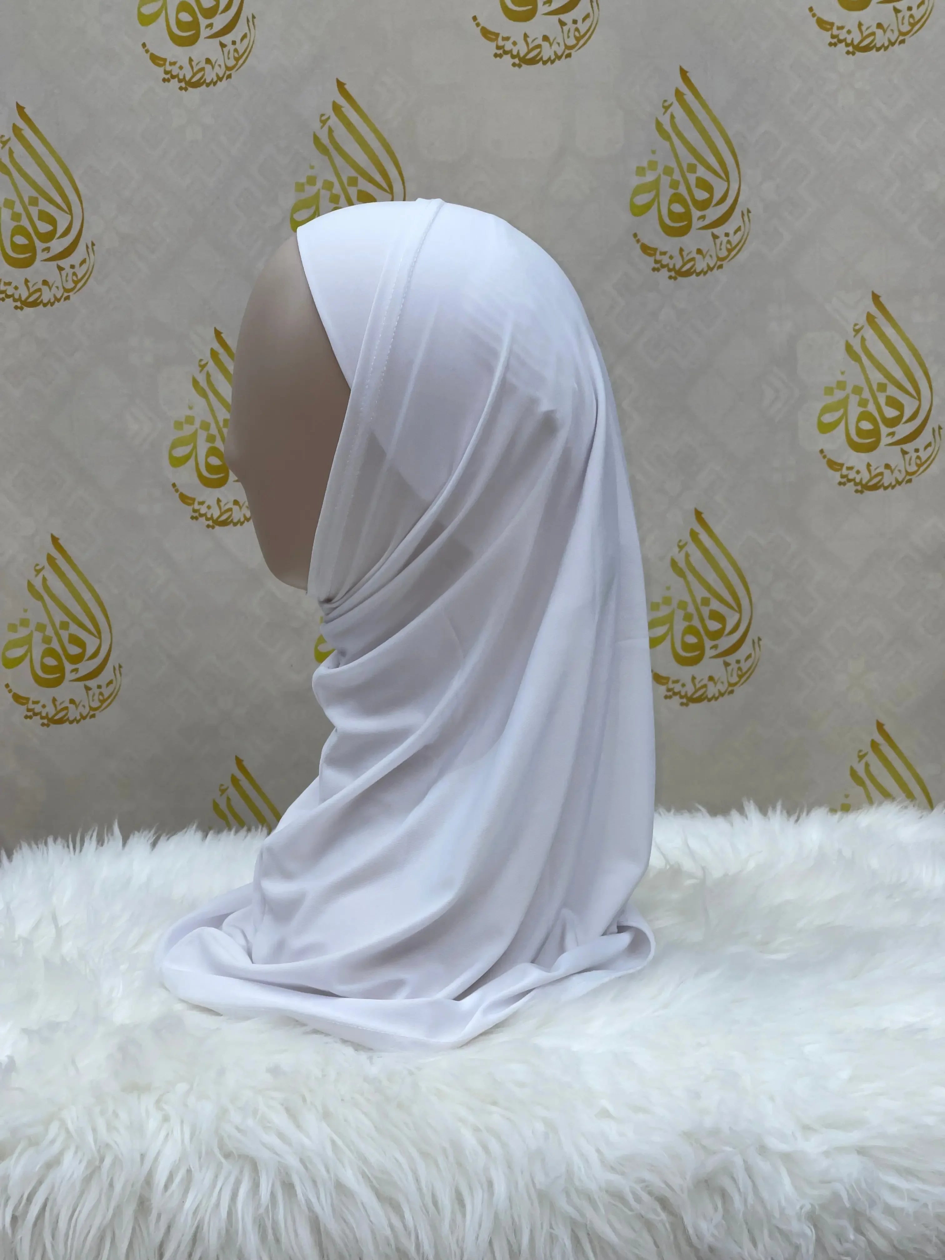 White lycra hijab for women displayed on mannequin by Palestinian Elegance smooth fabric modest style