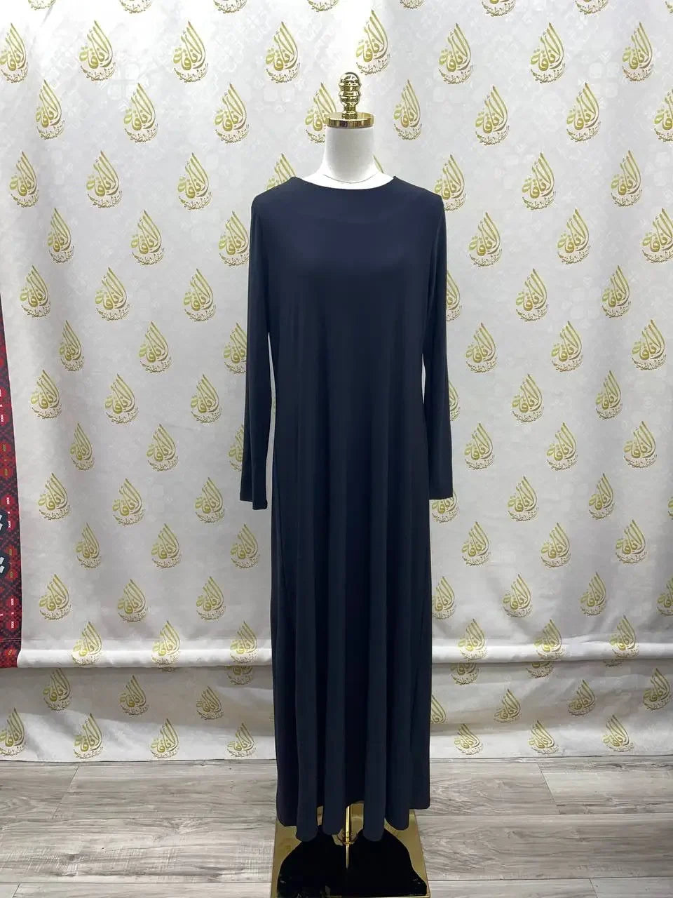Palestinian Elegance long black lycra inner dress for women displayed on mannequin