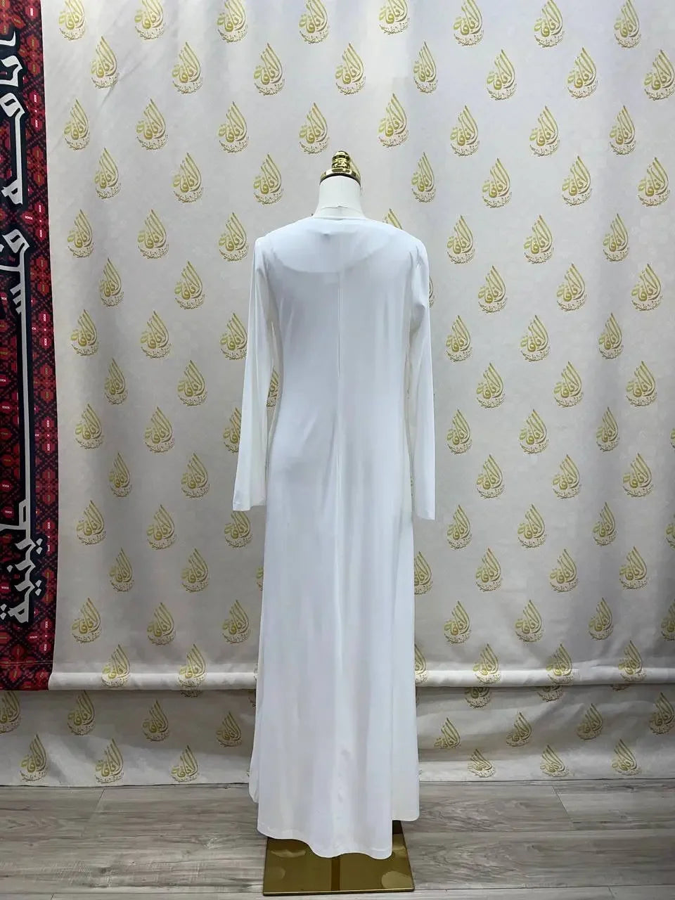 Back view of white lycra inner dress for women by Palestinian Elegance with long sleeves and full length design