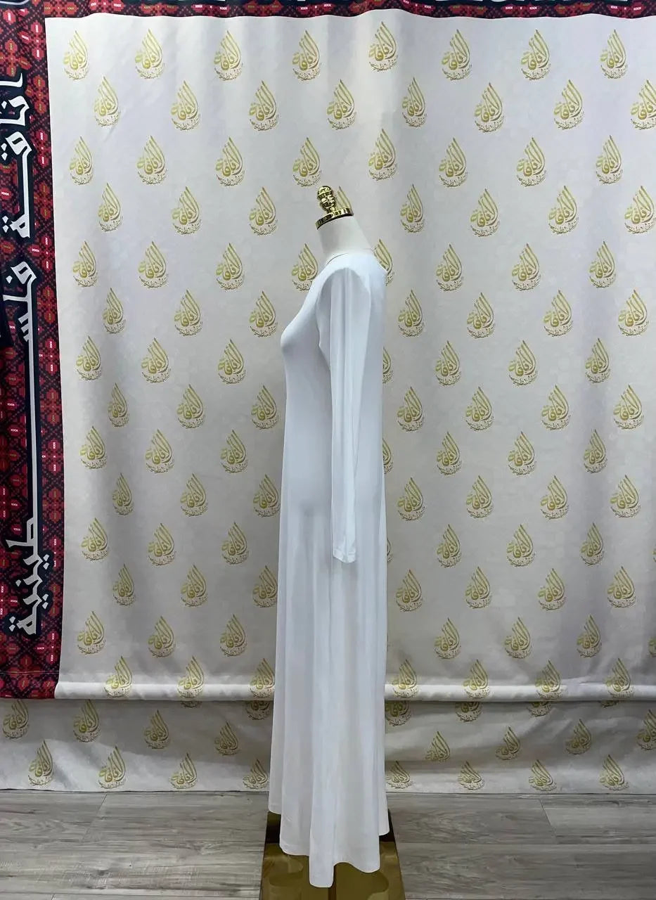 White lycra inner dress for women long sleeve full length on mannequin by Palestinian Elegance