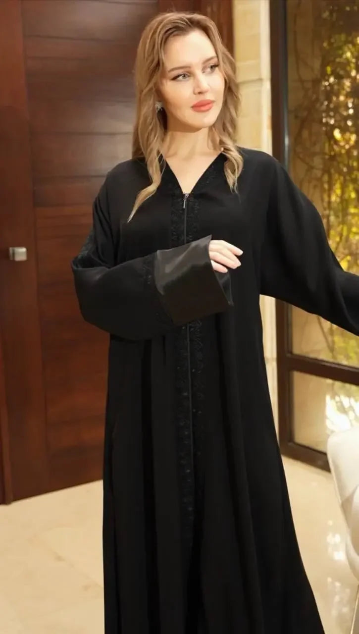 Palestinian Elegance black modern abaya for women with wide sleeves and intricate embroidery