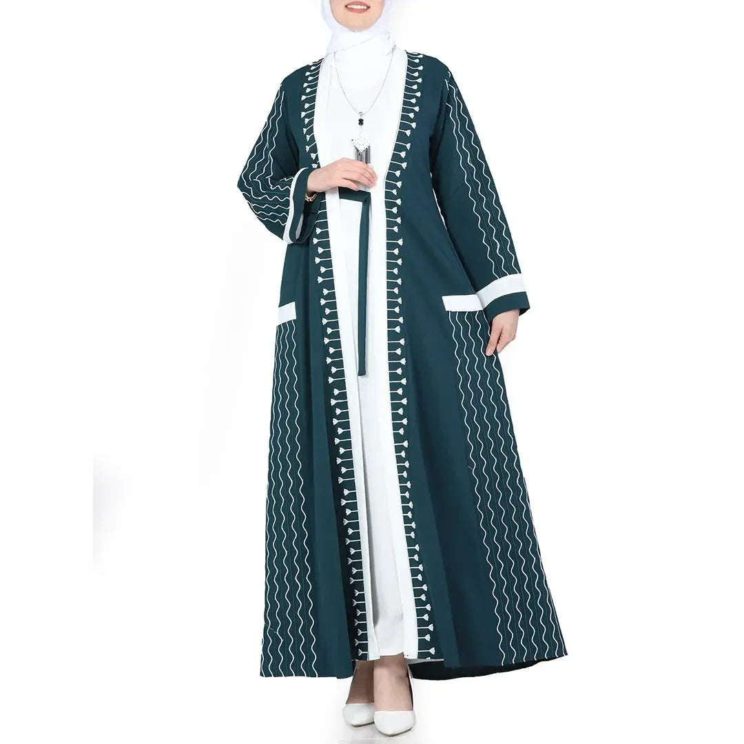 Palestinian Elegance modern embroidered abaya set in teal with white geometric detailing and matching white inner dress