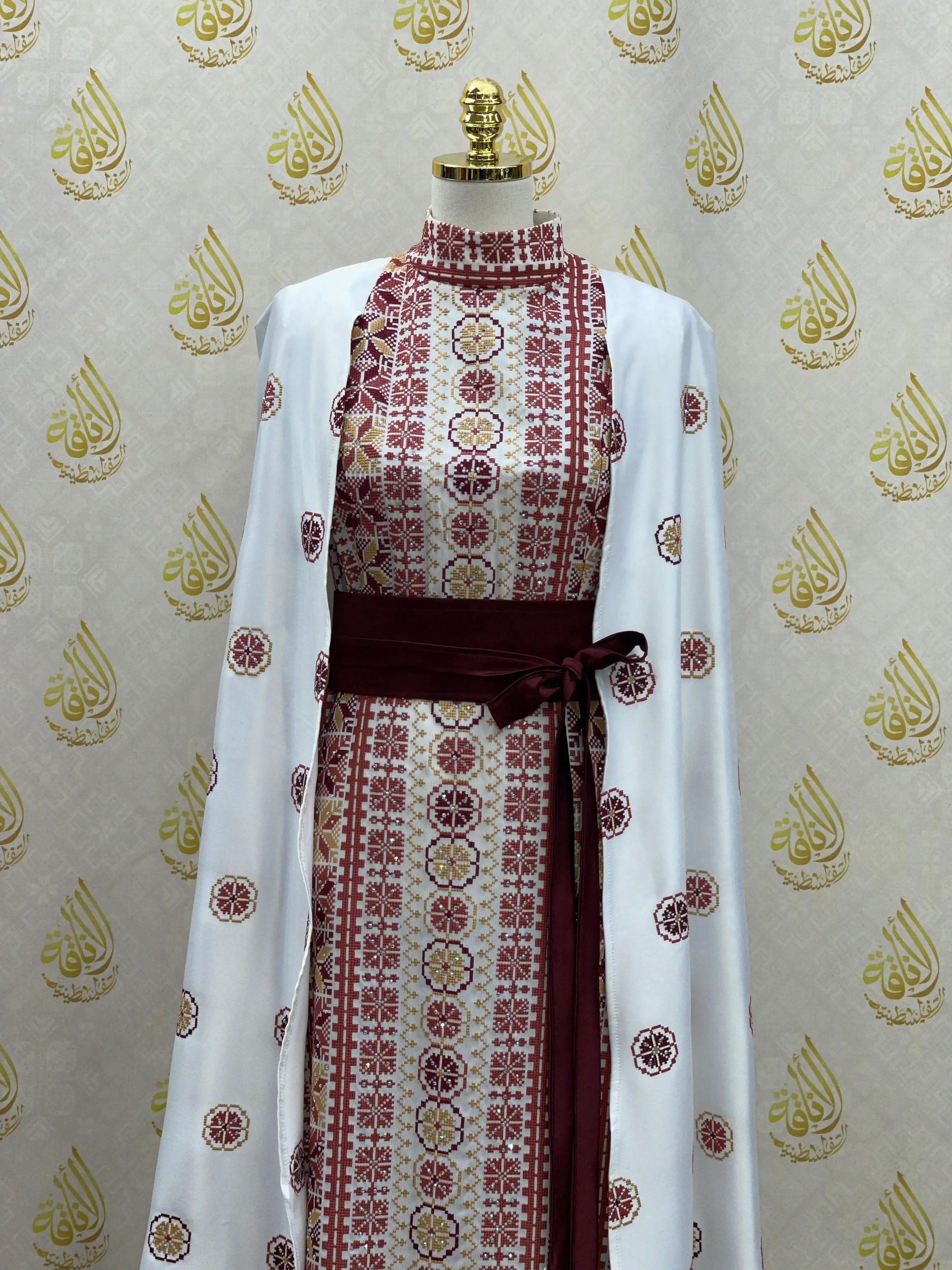 Palestinian Elegance modern embroidered thoub with intricate red and gold embroidery and white fabric