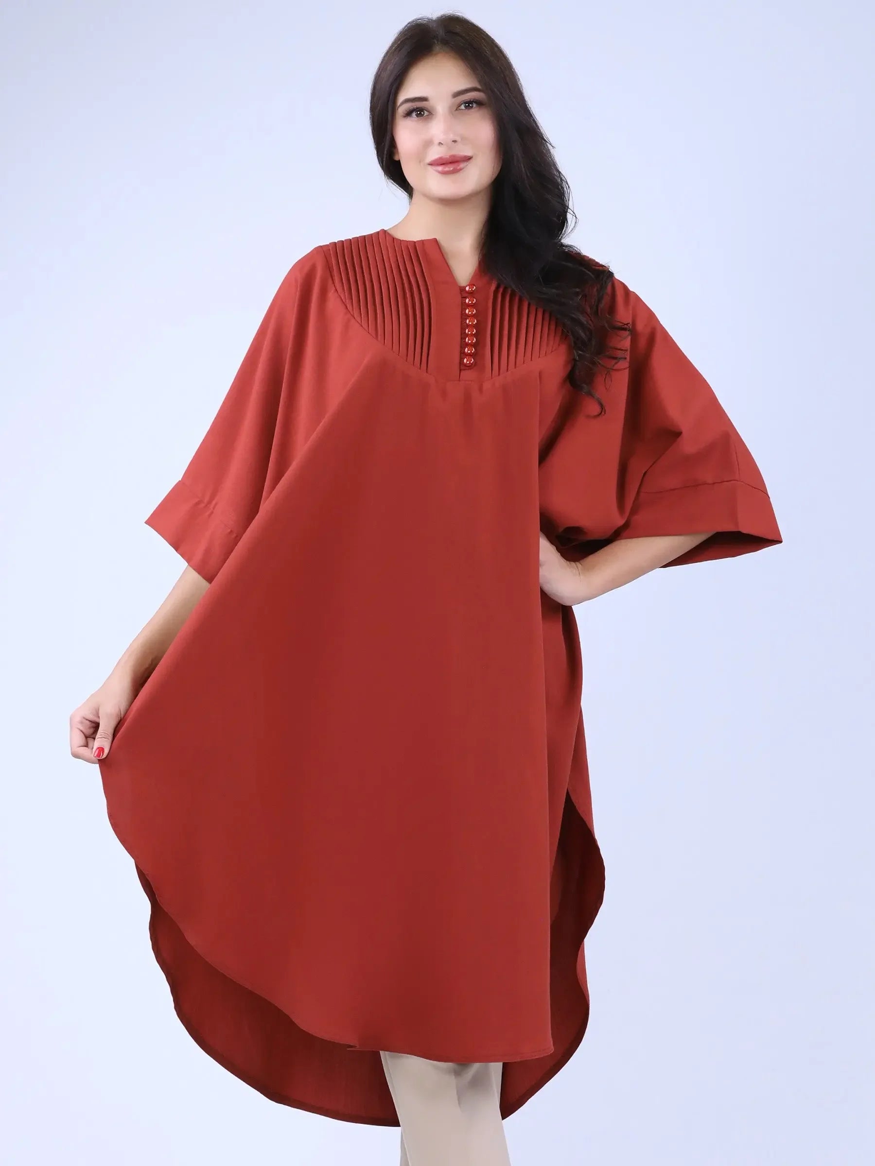 Palestinian Elegance modest cape top in rust color with pleated detailing and loose fit casual style