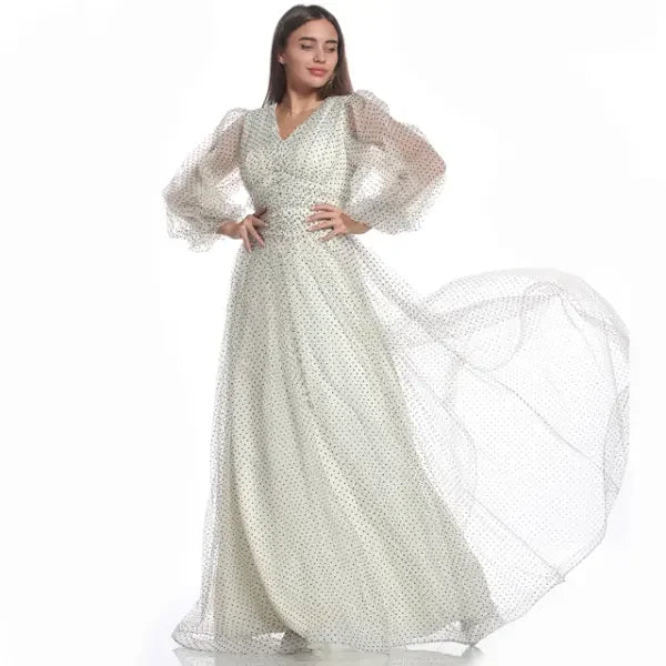 Palestinian Elegance modest dotted dress for women with sheer puff sleeves and flowing skirt
