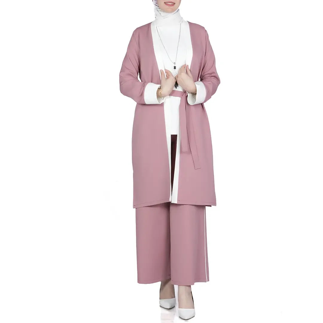 Modest spring outfit set by Palestinian Elegance featuring a pink long open cardigan and matching wide-leg pants