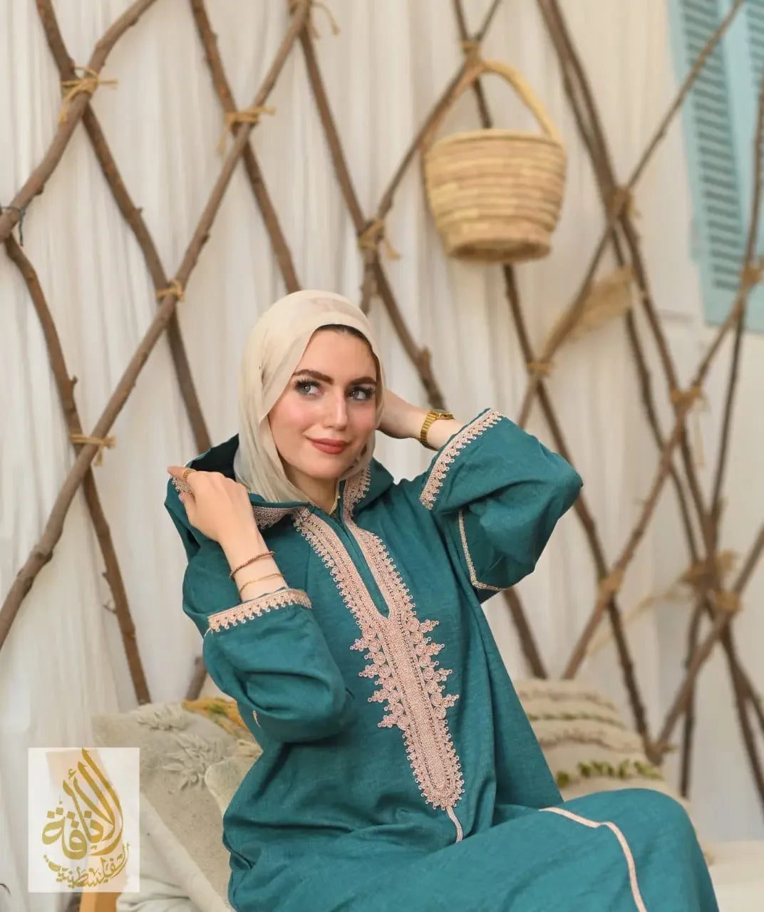 Palestinian Elegance jilbab featuring Moroccan embroidered kaftan dress in teal with intricate beige embroidery