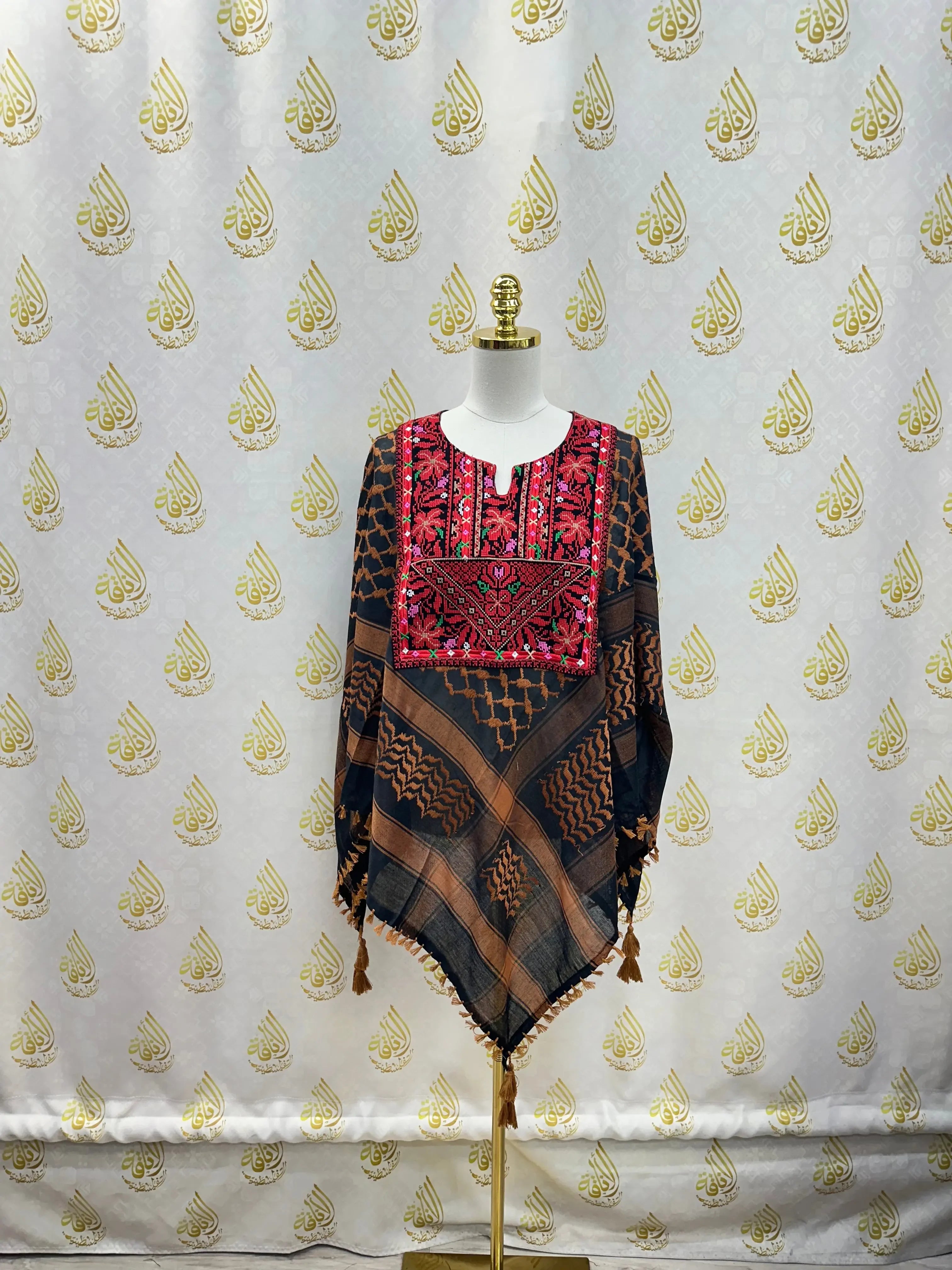 Palestinian Elegance multicolor kuffiyeh shirt with traditional embroidery and tassels on mannequin