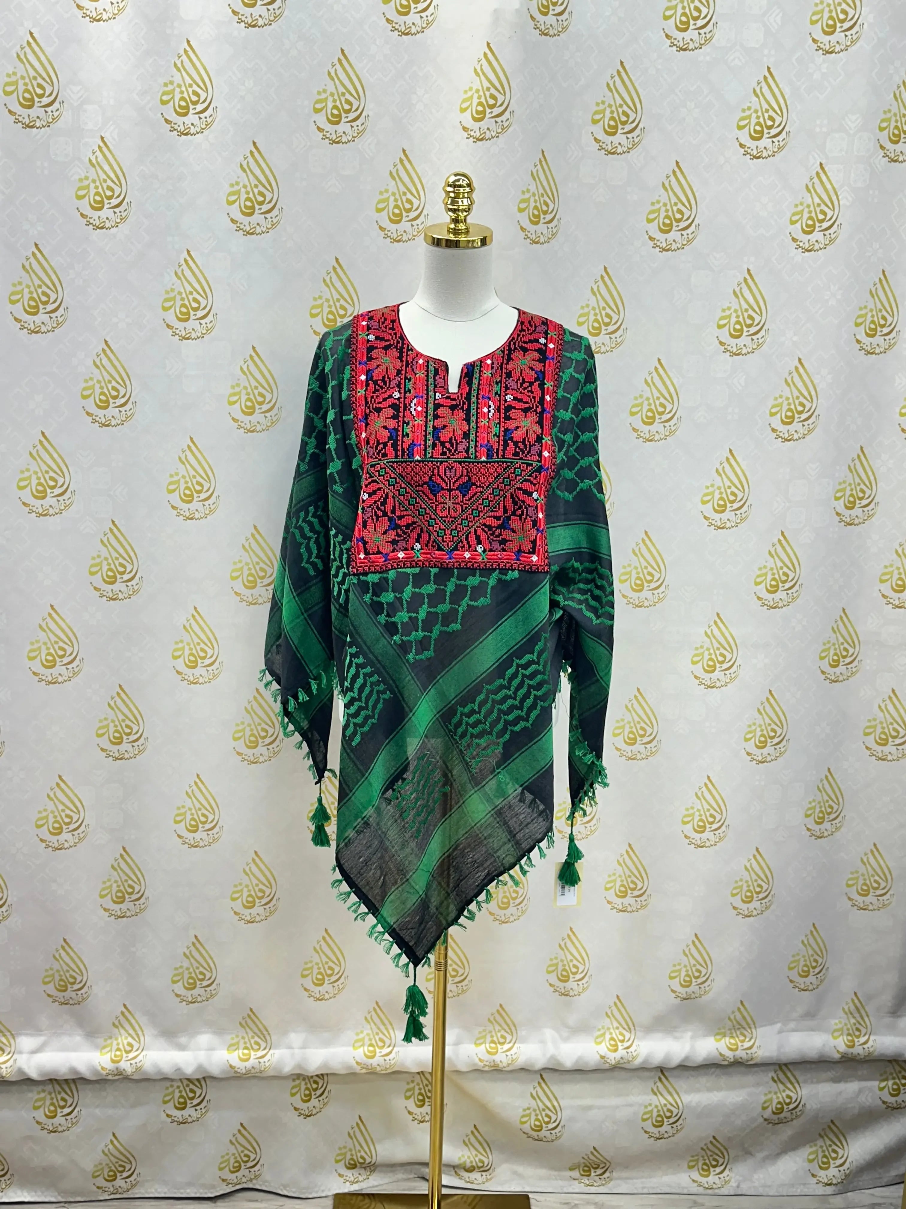 Palestinian Elegance multicolor kuffiyeh shirt with green and red traditional embroidery on mannequin