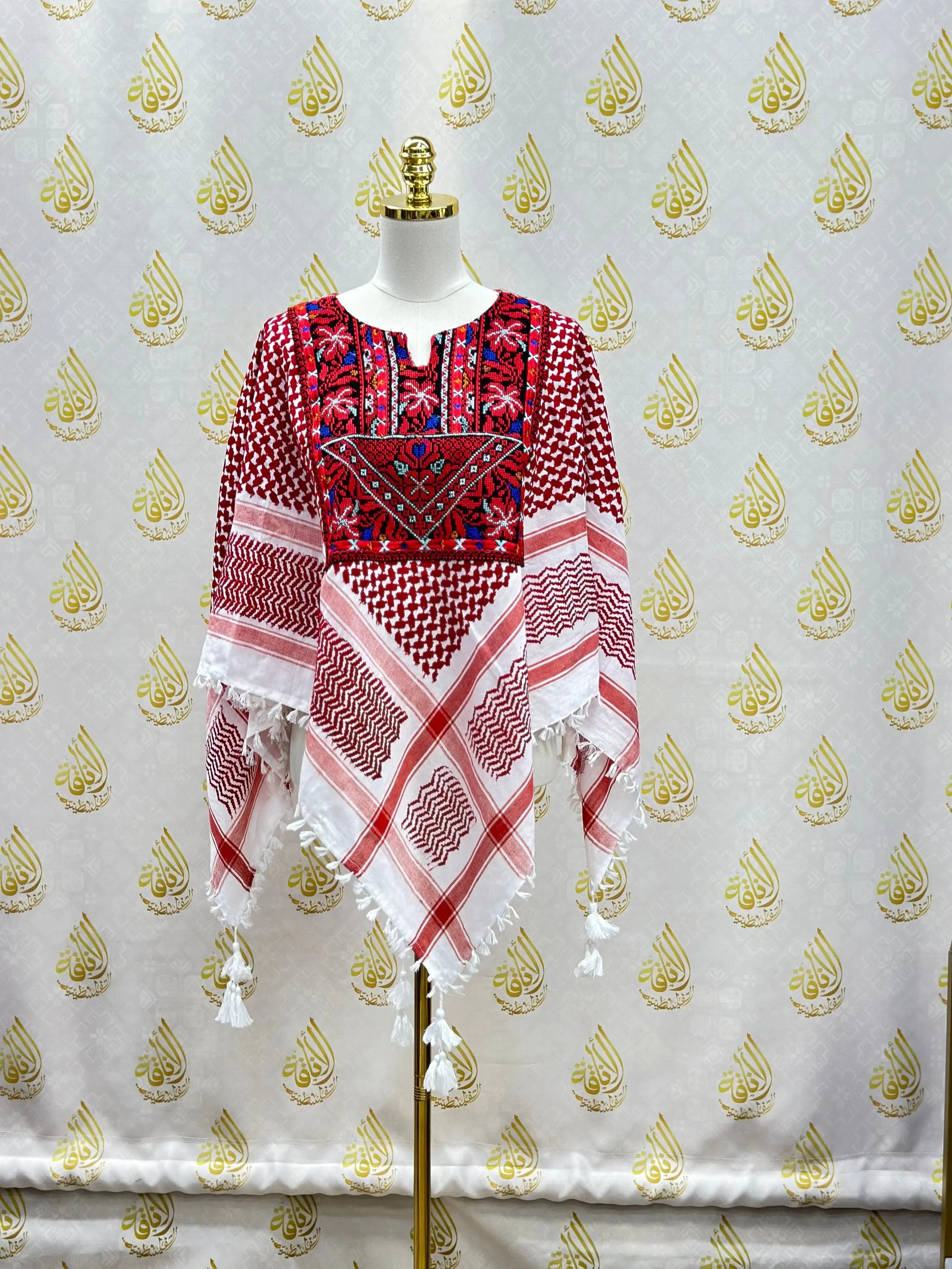 Palestinian Elegance multicolor kuffiyeh shirt with intricate embroidery and tassels on a mannequin
