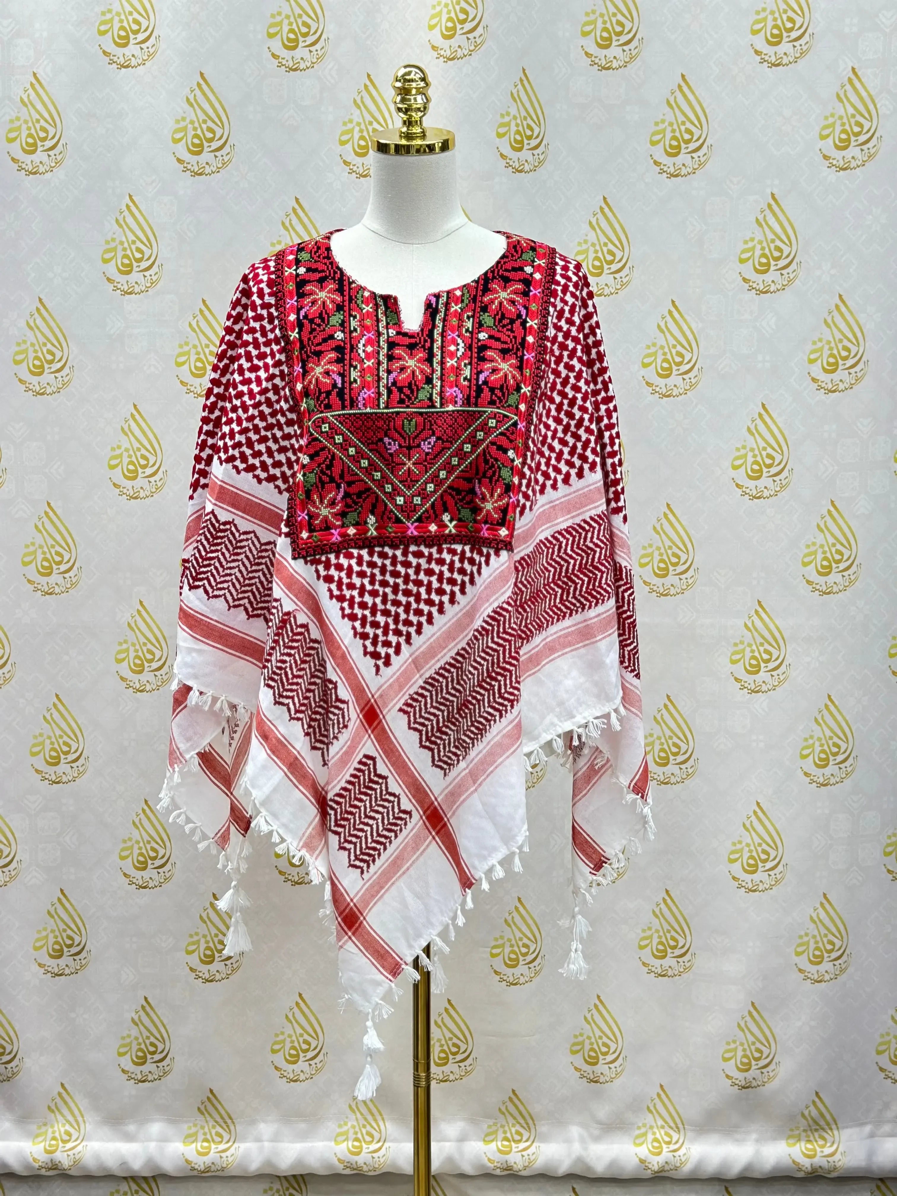 Palestinian Elegance multicolor kuffiyeh shirt with traditional red embroidery and tassels on a mannequin