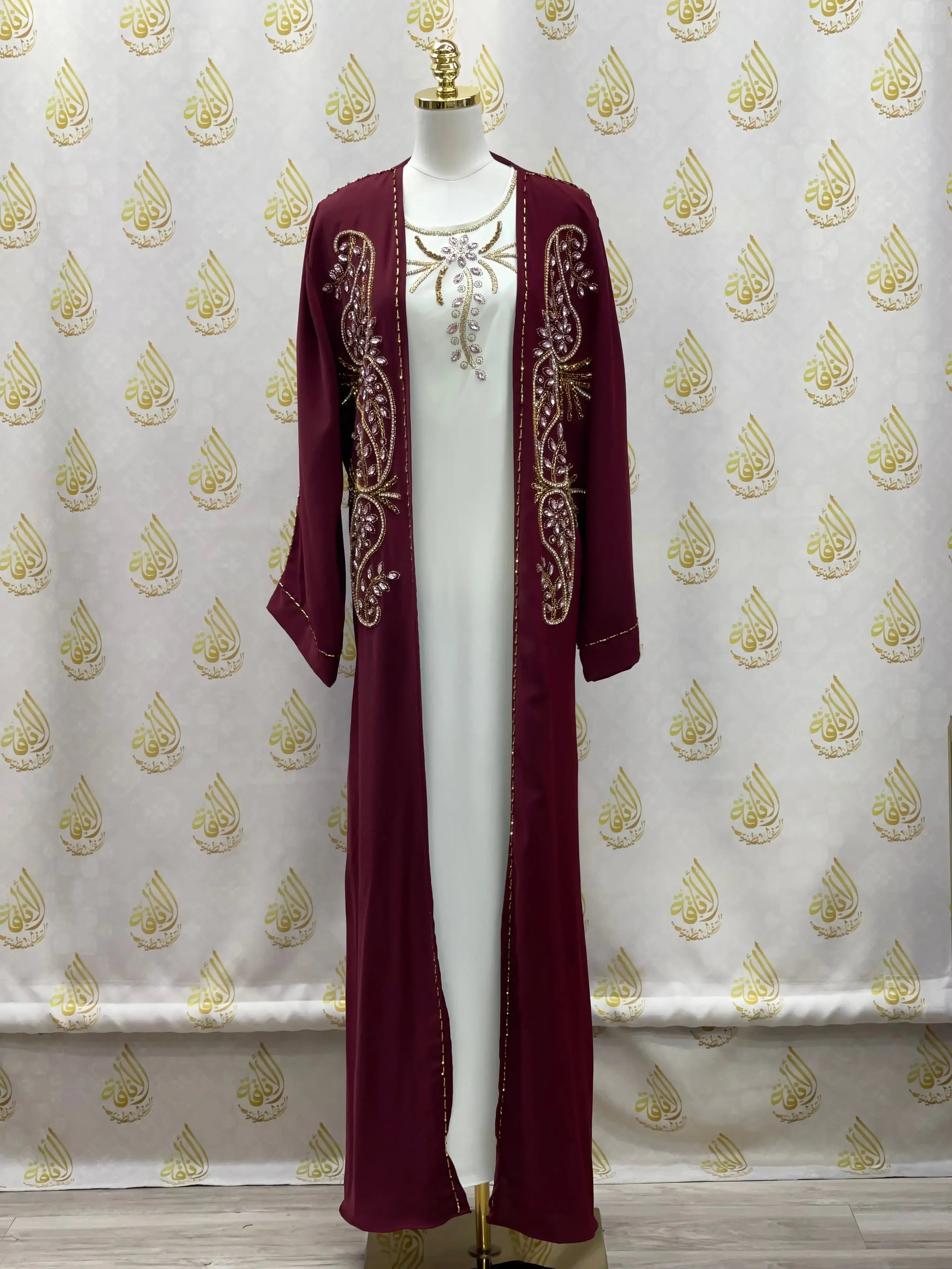 Palestinian Elegance open abaya set featuring a white inner dress with a maroon embroidered outer abaya