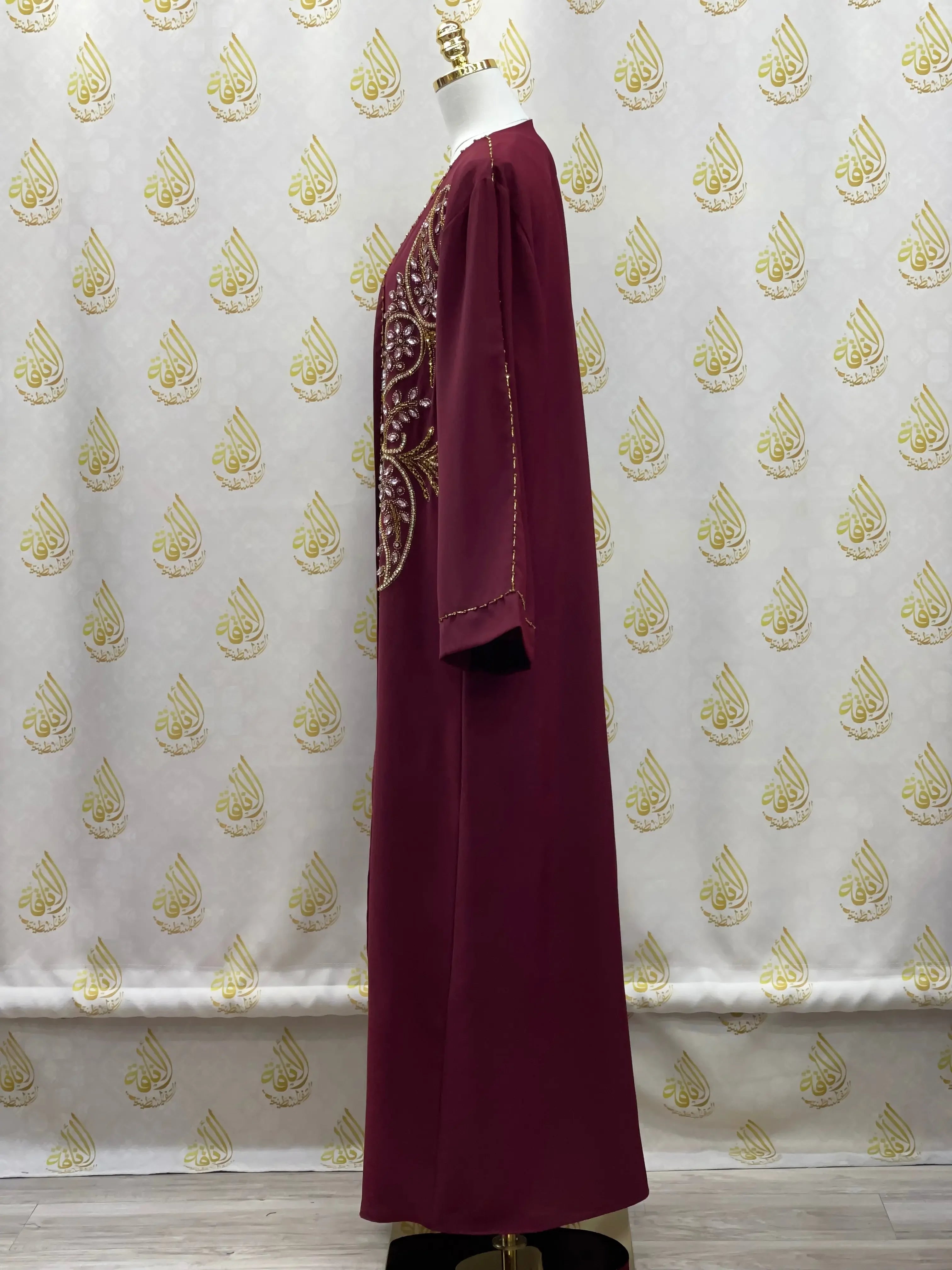 Palestinian Elegance maroon open abaya set with intricate gold embroidery on the front and sleeves