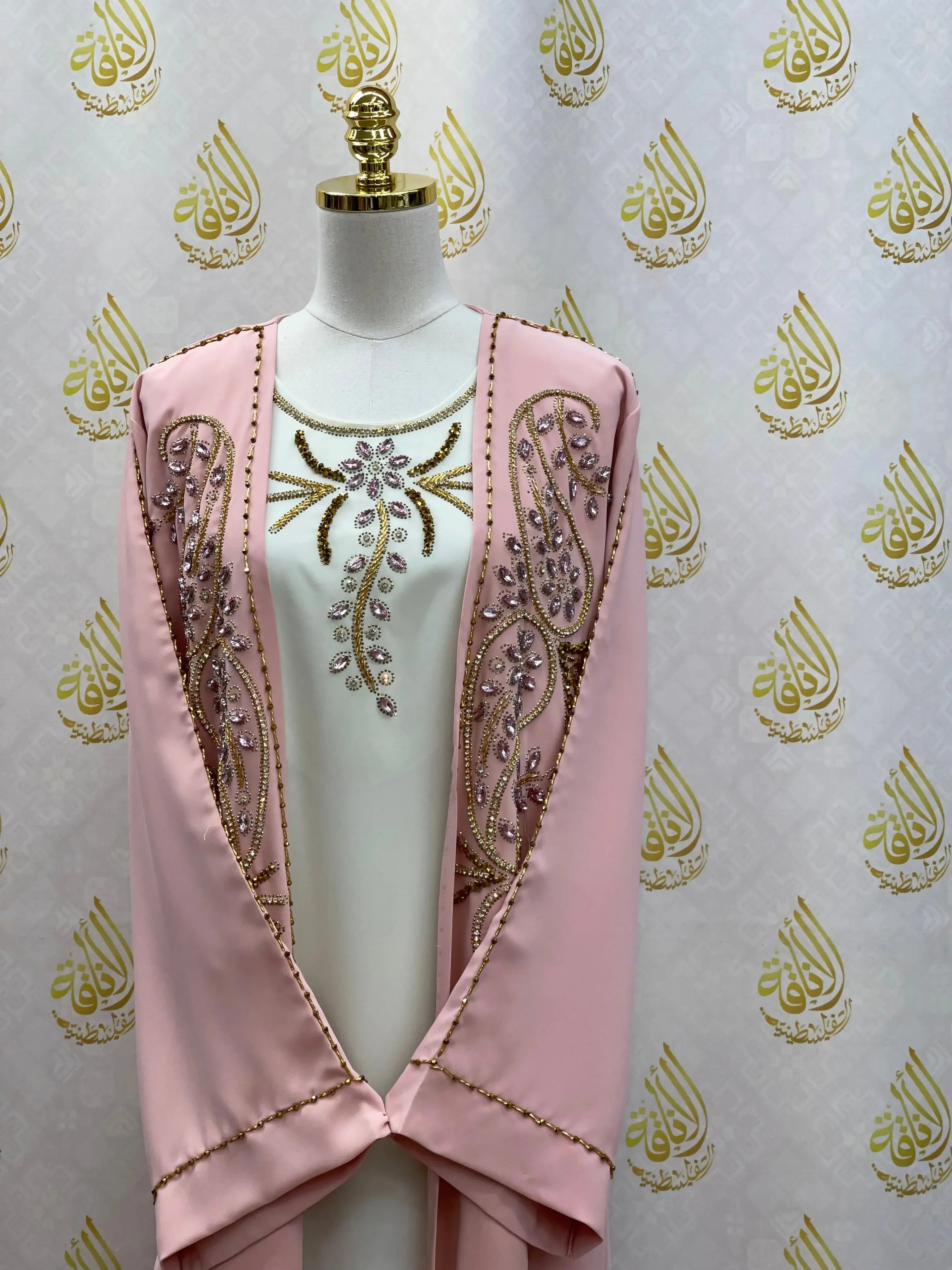 Palestinian Elegance pink open abaya set with intricate bead and sequin embroidery on white inner dress