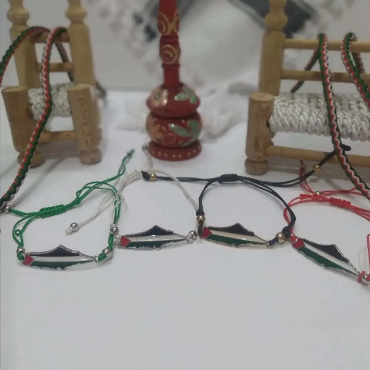 Palestine bracelet with gold beads featuring the Palestinian flag colors on adjustable cords