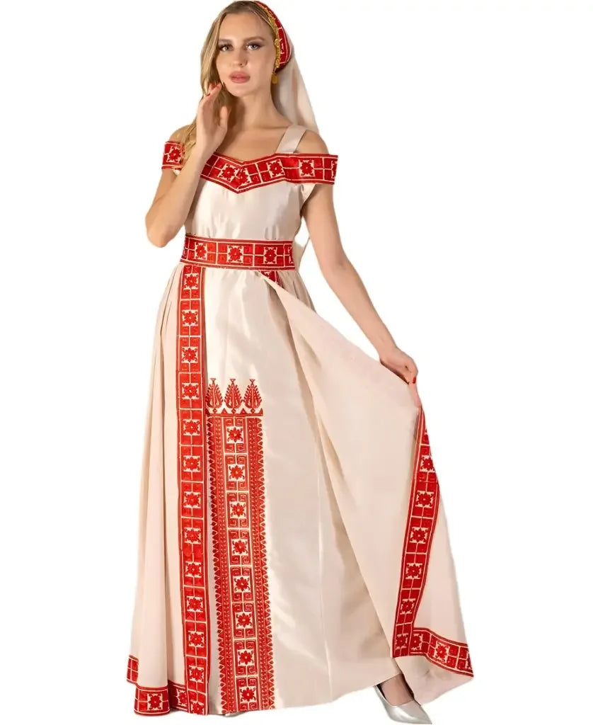 Palestinian bridal thobe by Palestinian Elegance featuring traditional red embroidery on white fabric