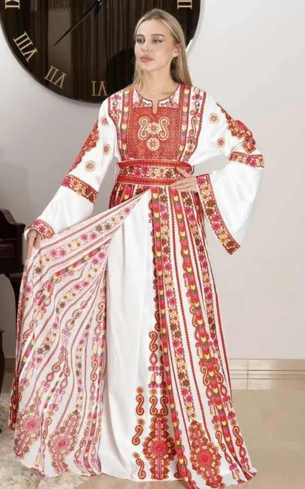 Palestinian bridal thoub dress by Palestinian Elegance with intricate red embroidery on white fabric