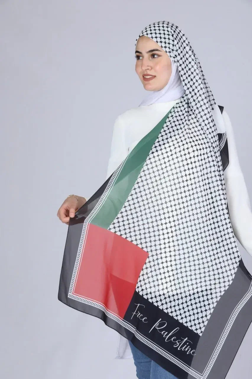 Palestinian chiffon hijab by Palestinian Elegance featuring traditional black and white pattern with green and red accents