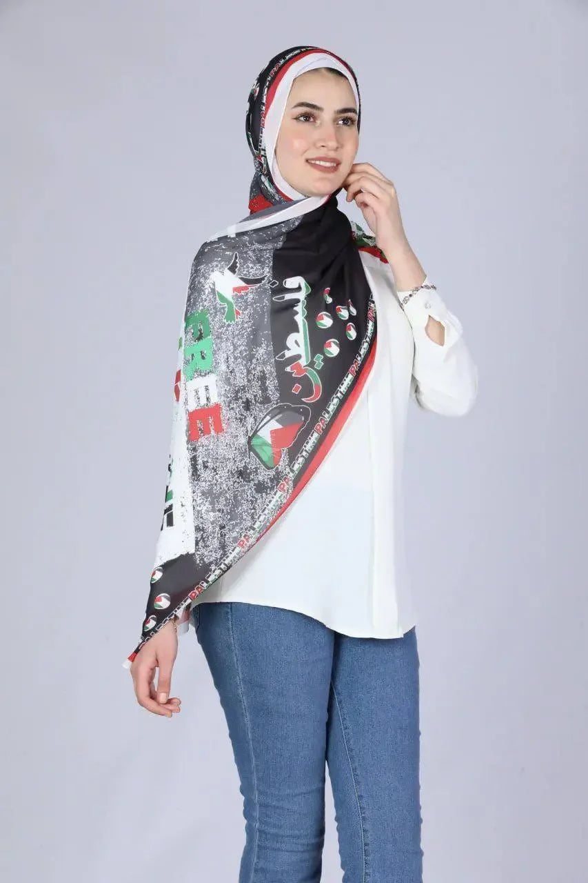Palestinian Elegance model wearing a black Palestinian chiffon hijab with vibrant cultural patterns