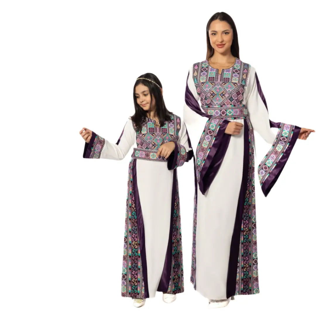 Mother and daughter wearing Palestinian Elegance mother daughter matching thobe with purple and colorful embroidery