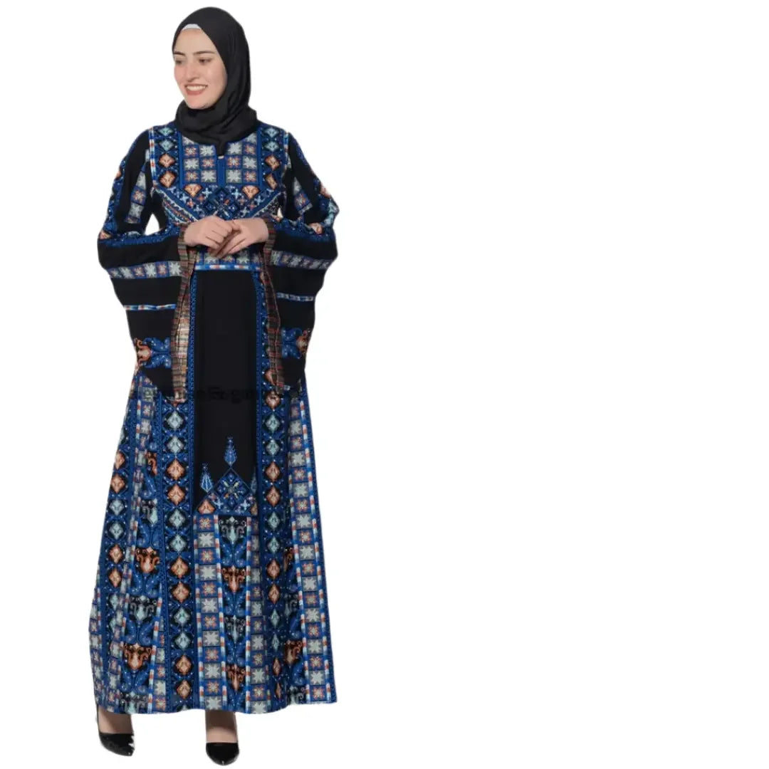 Woman wearing a blue and black Palestinian embroidered dress with traditional geometric patterns