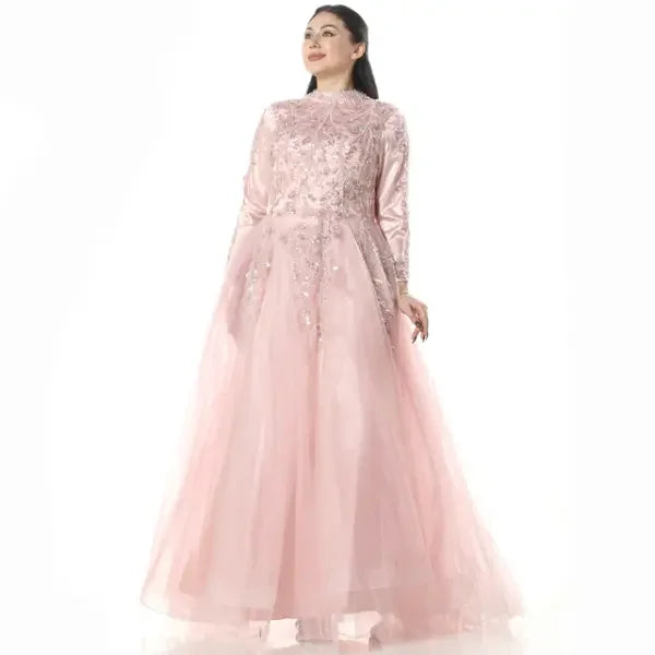 Palestinian embroidered dress in soft pink with intricate floral embroidery and tulle skirt by Palestinian Elegance