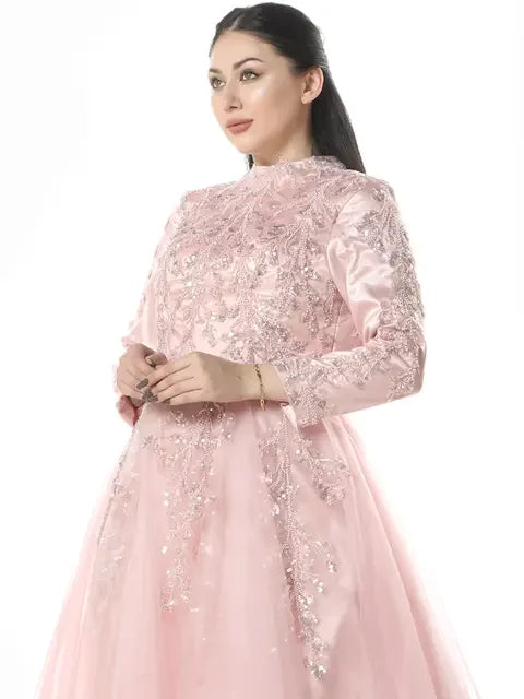 Pink Palestinian embroidered dress with intricate floral patterns and long sleeves by Palestinian Elegance