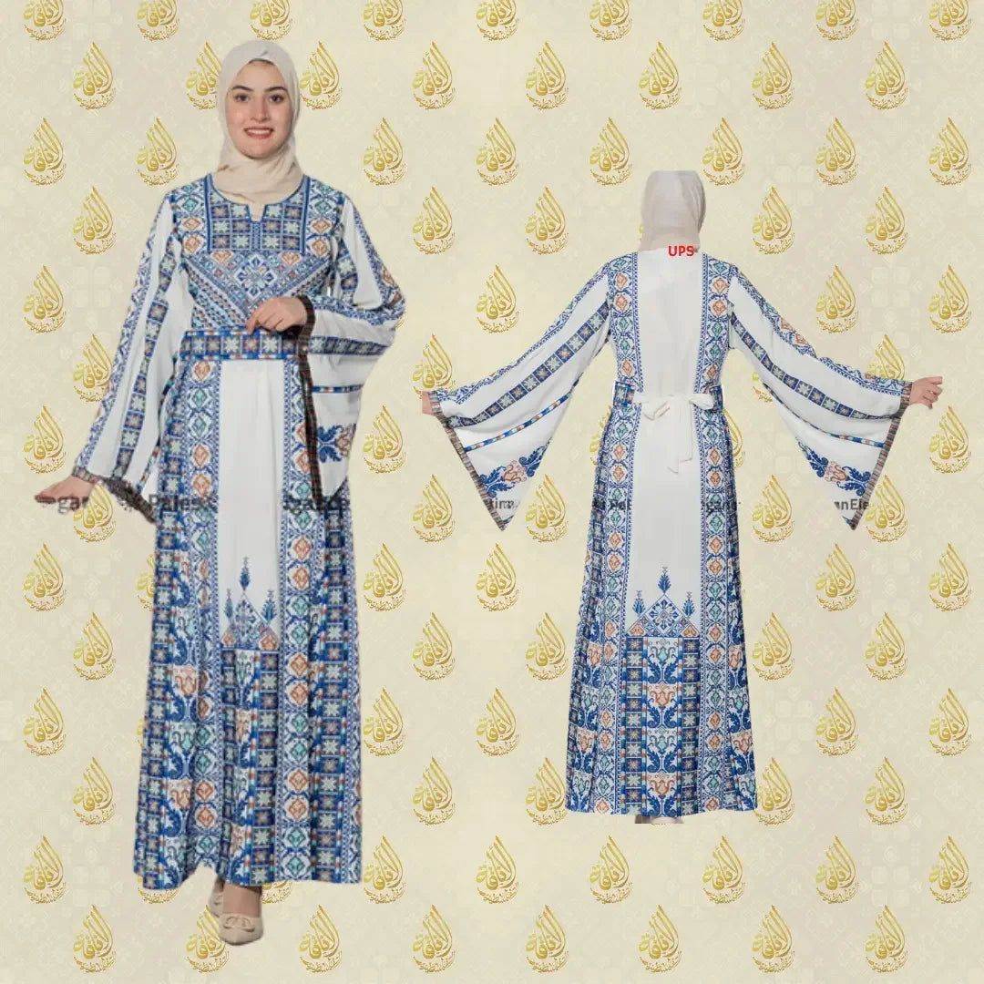 Palestinian embroidered dress by Palestinian Elegance featuring blue and white traditional embroidery with long bell sleeves