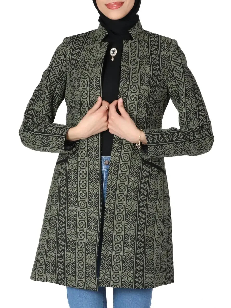 Palestinian embroidered jacket in black and green geometric patterns by Palestinian Elegance