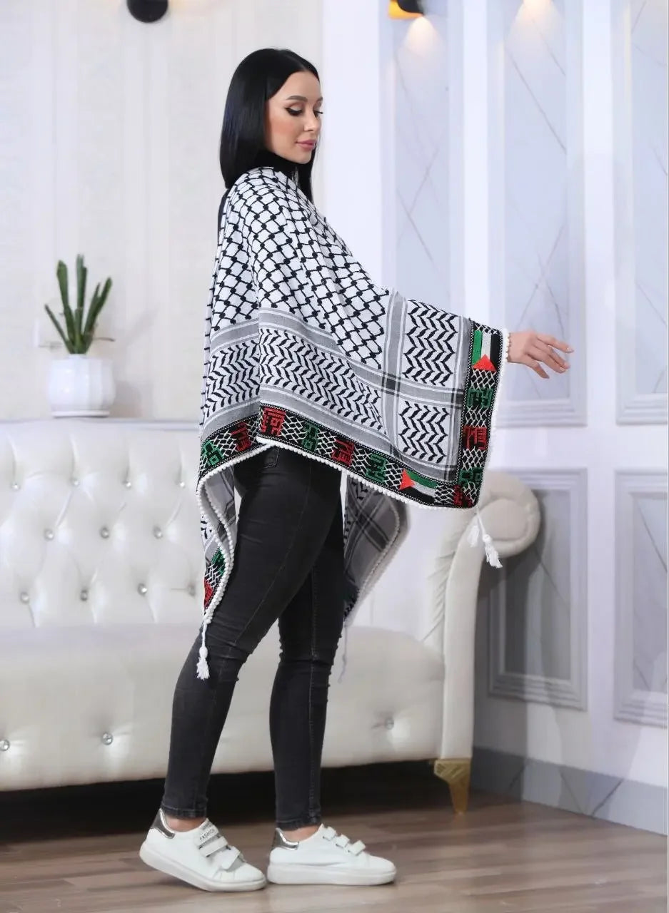 Woman wearing Palestinian embroidered kuffiyeh shawl with traditional black, white, red, and green patterns