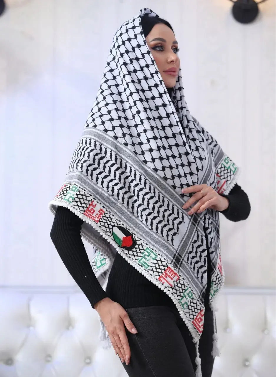 Woman wearing embroidered Palestinian kuffiyeh with traditional black and white pattern and colorful embroidery