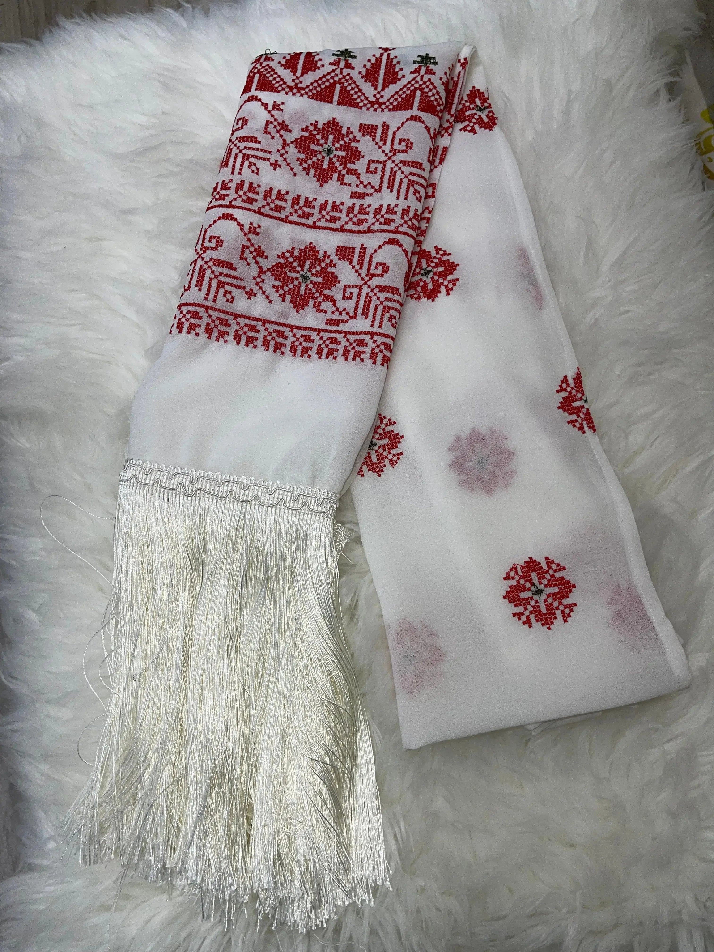 Palestinian embroidered shawl in white with red geometric designs and long fringes from Palestinian Elegance