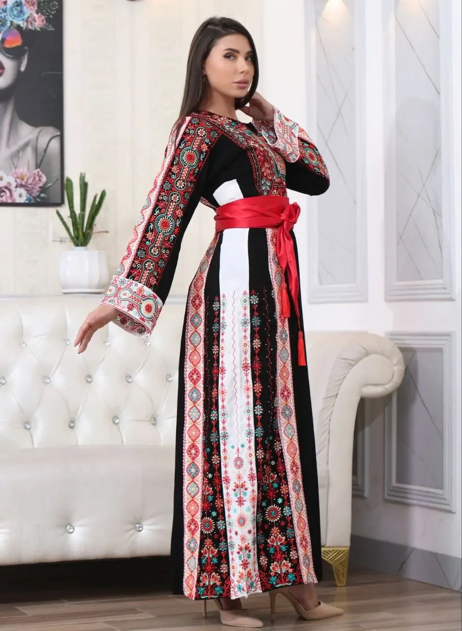 Palestinian embroidered thobe with intricate red and black embroidery and a red sash belt