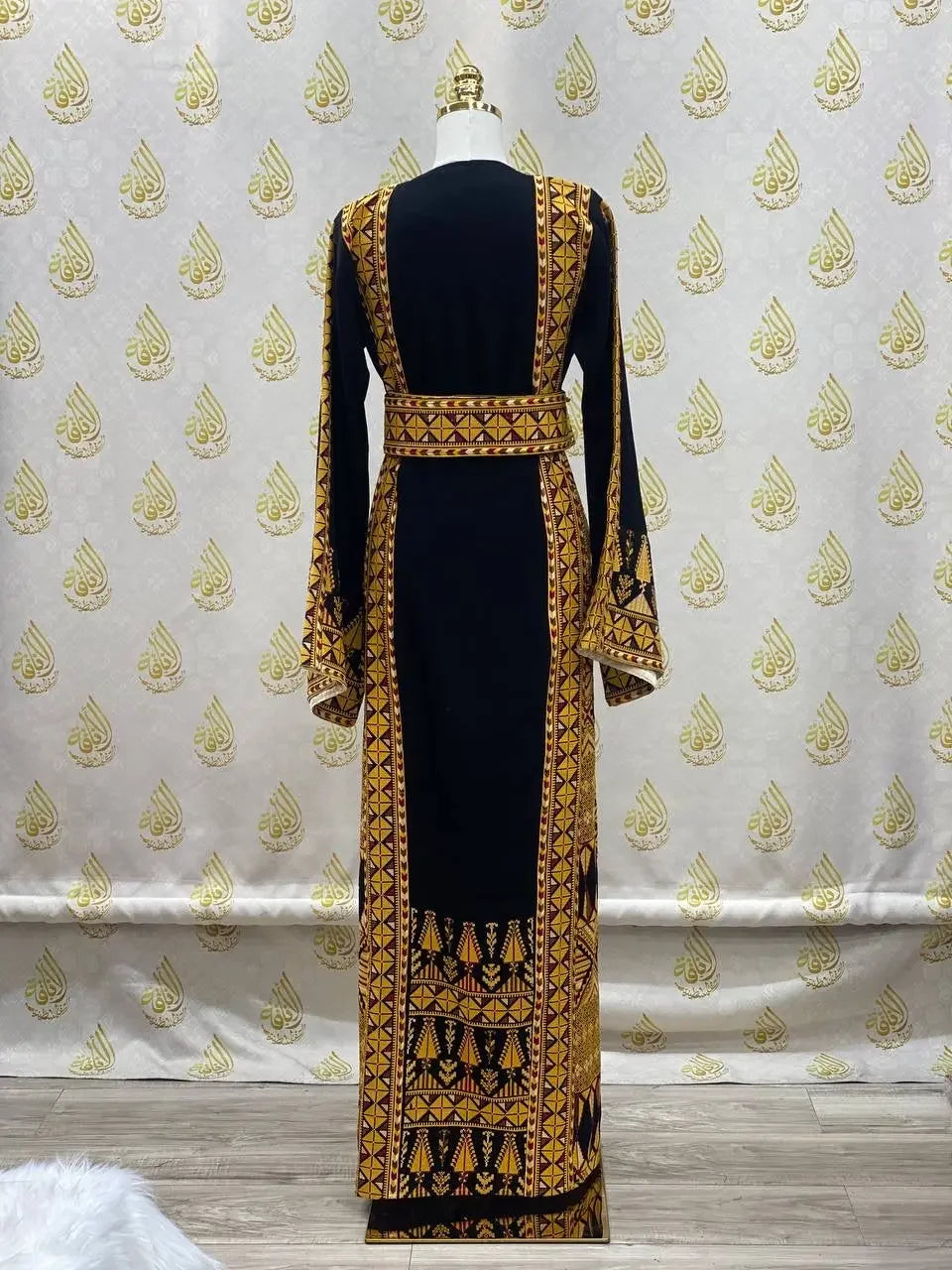 Black Palestinian embroidered thobe dress with intricate yellow traditional embroidery by Palestinian Elegance