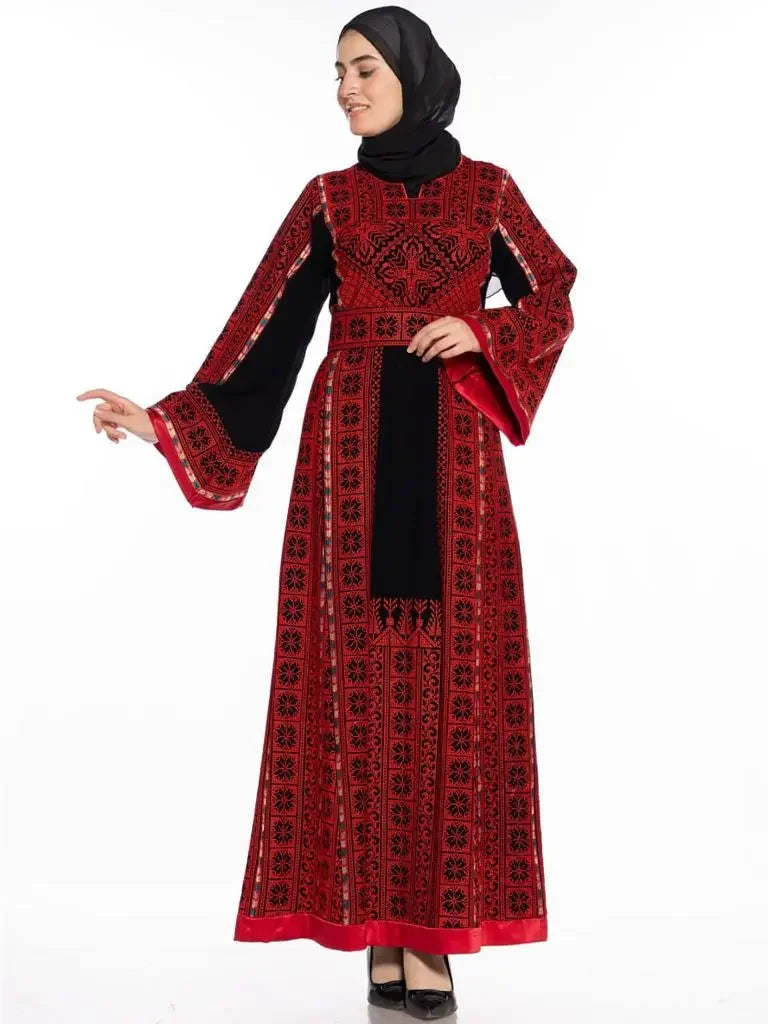 Palestinian embroidered thobe dress in red and black by Palestinian Elegance with intricate embroidery and long sleeves