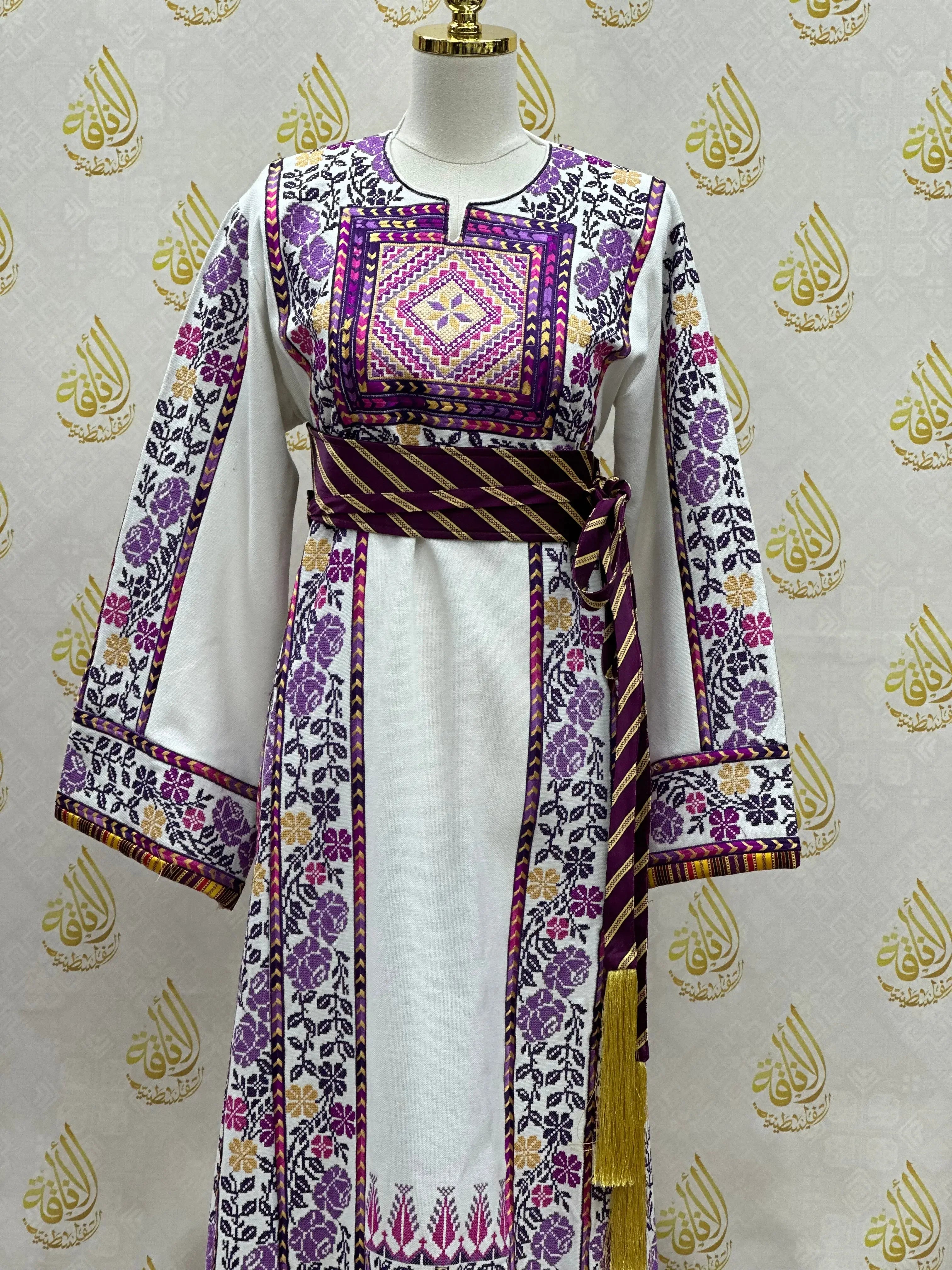 Palestinian embroidered thobe with intricate purple floral designs and matching belt by Palestinian Elegance