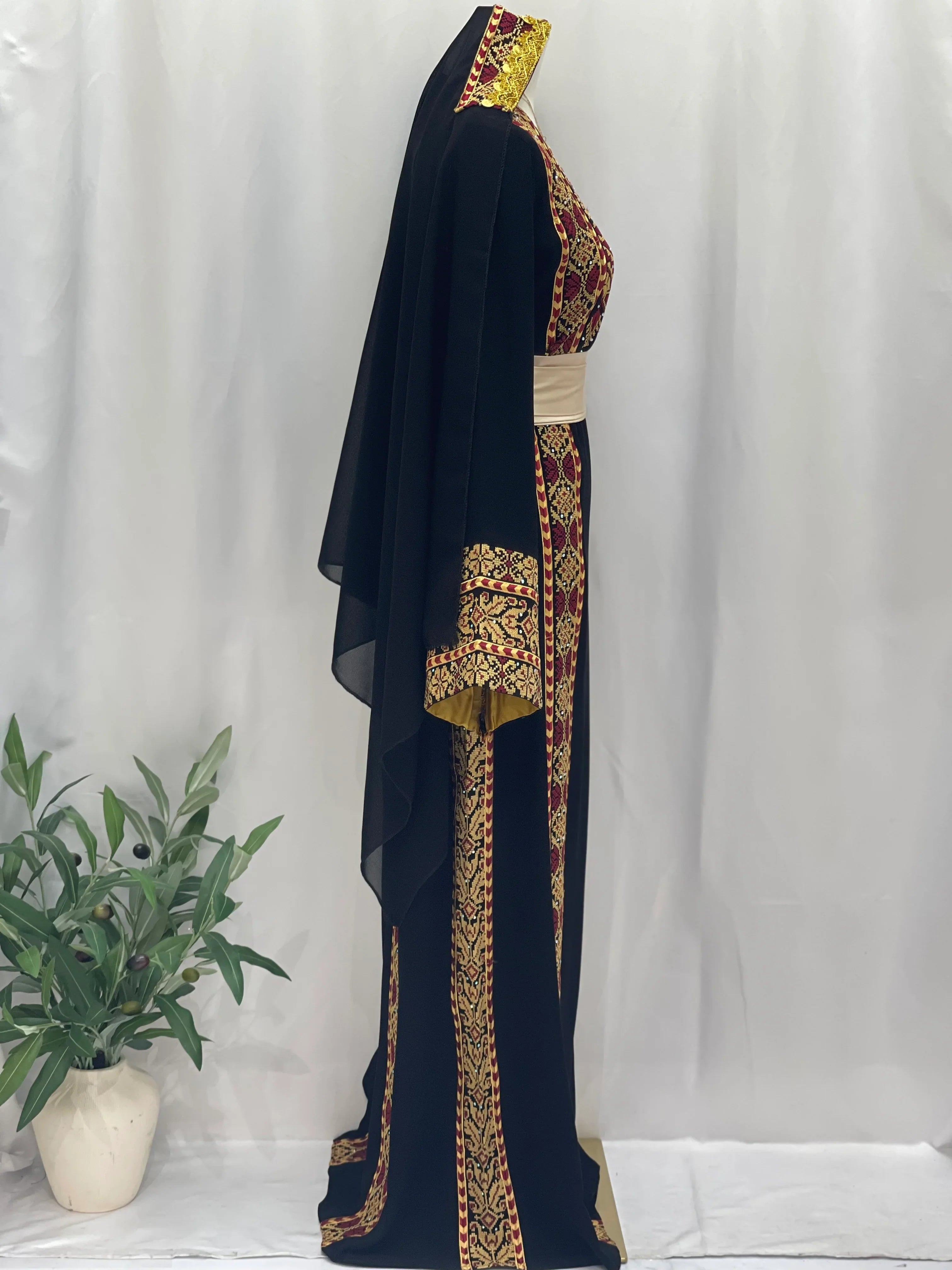 Palestinian embroidered thoub by Palestinian Elegance in black with red and gold embroidery and matching scarf